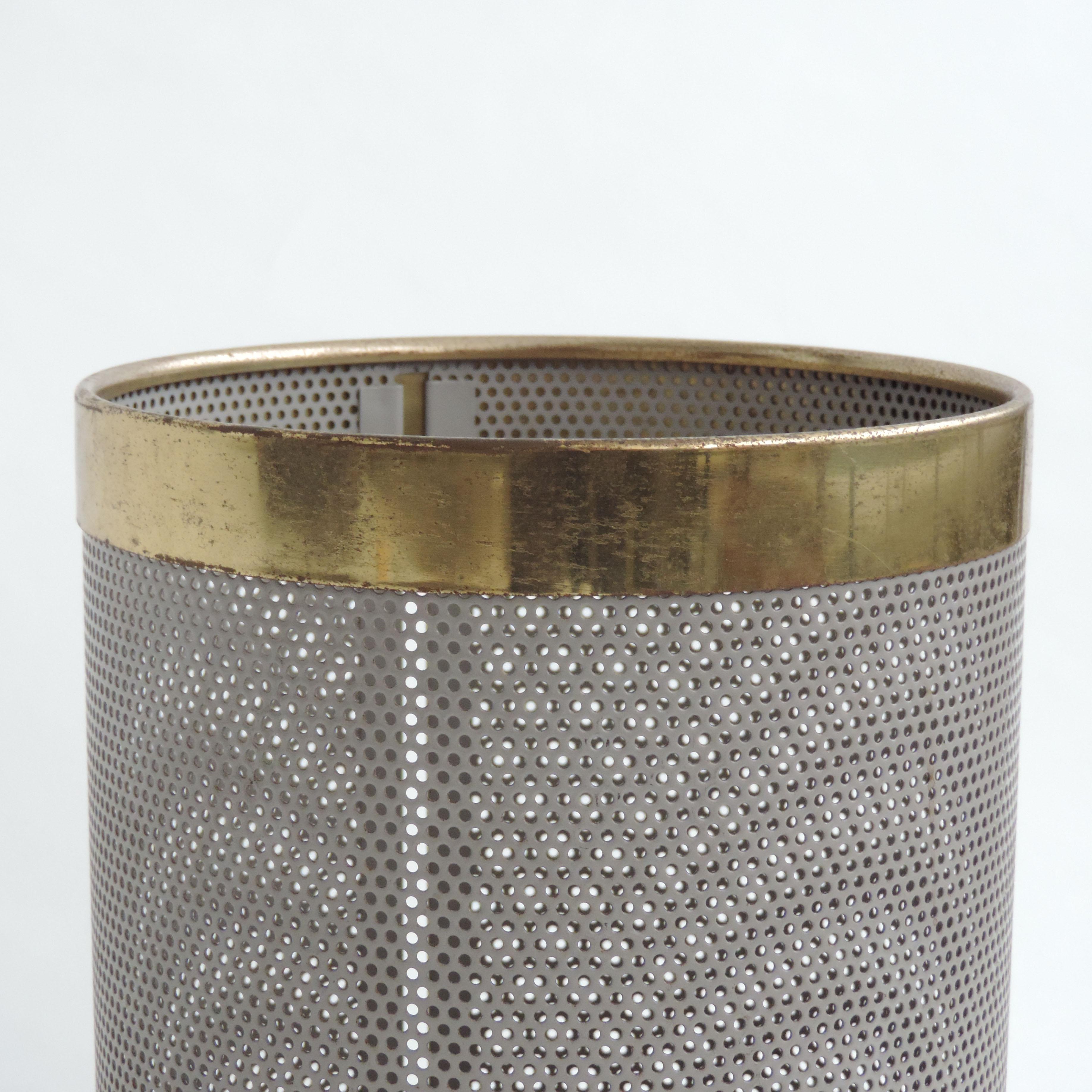Modernist perforated Italian Wastepaper bin in grey metal and brass
Italy 1960s.