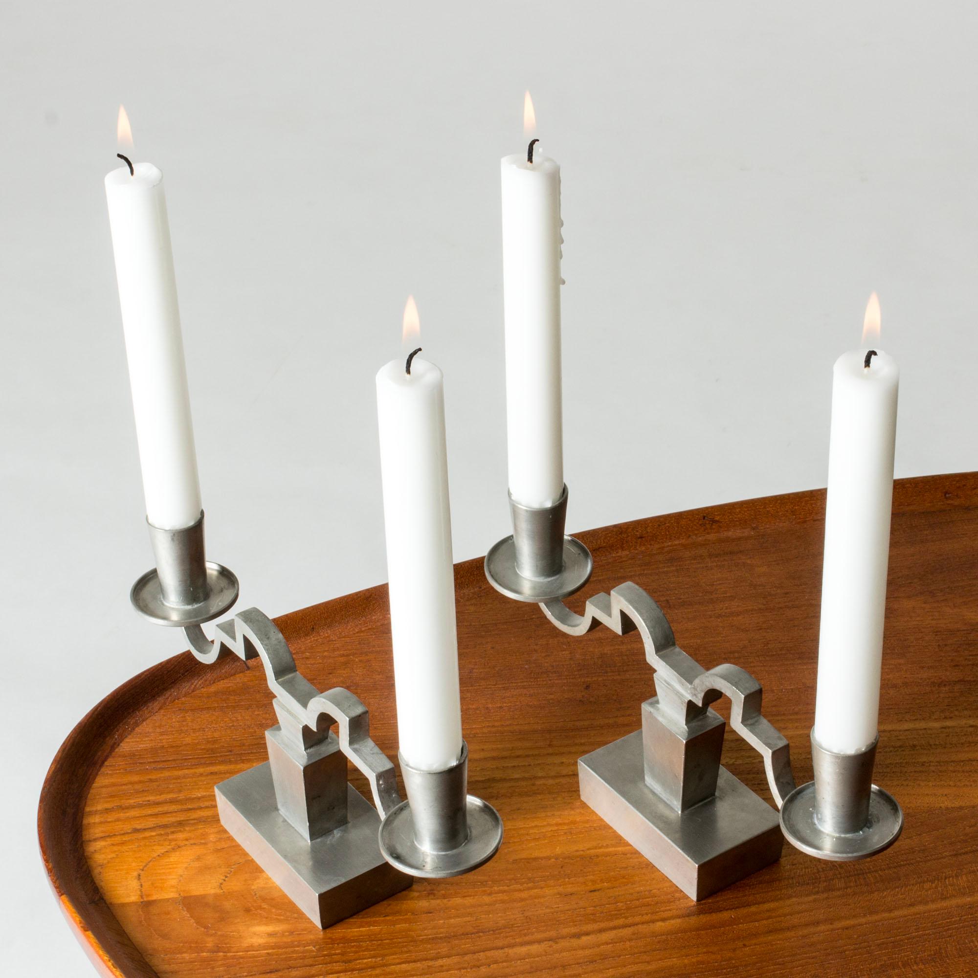 Pair of elegant pewter candlesticks by Niels Fougstedt. Clean cut lines and decorative details.

