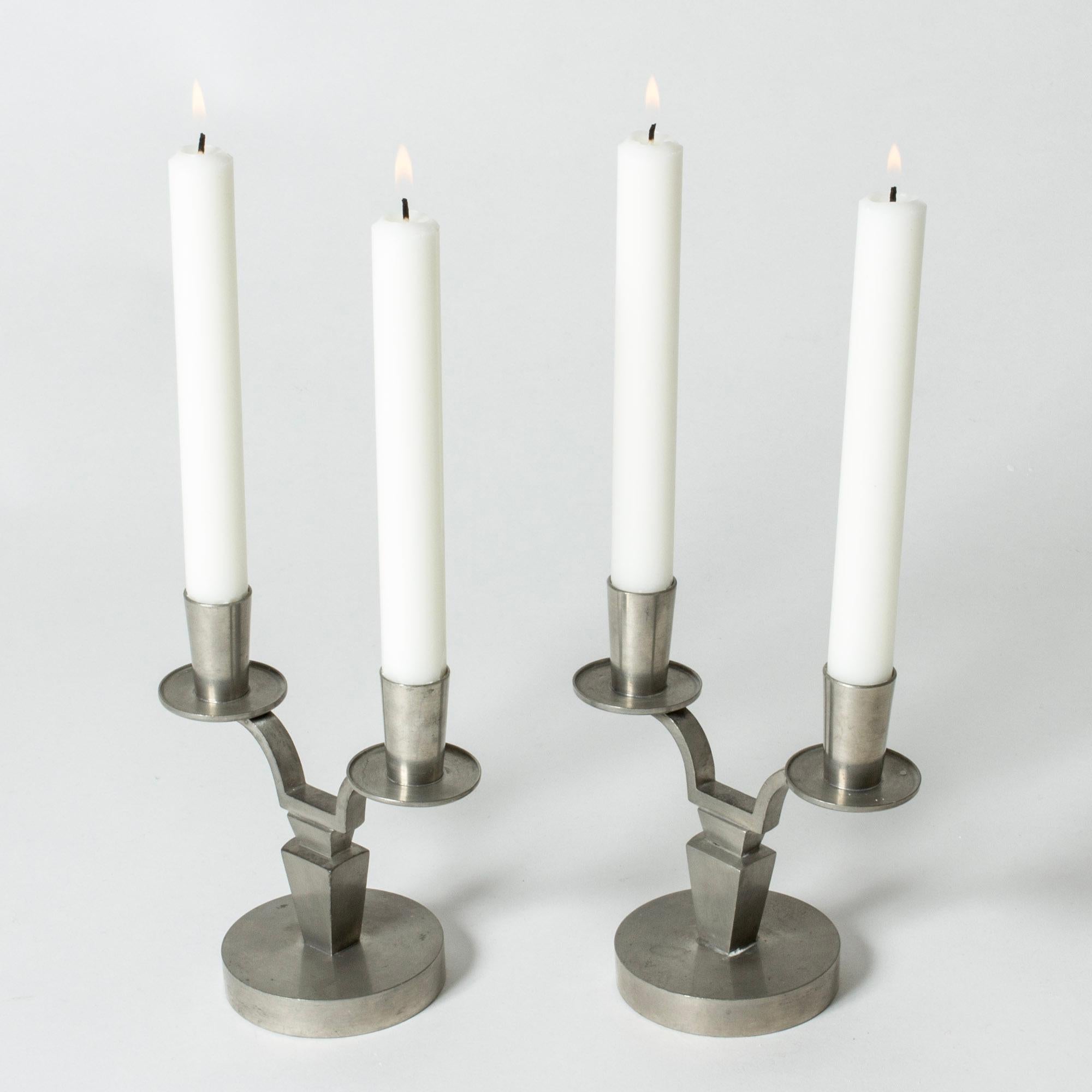 Pair of elegant pewter candlesticks by Niels Fougstedt. Clean cut lines.