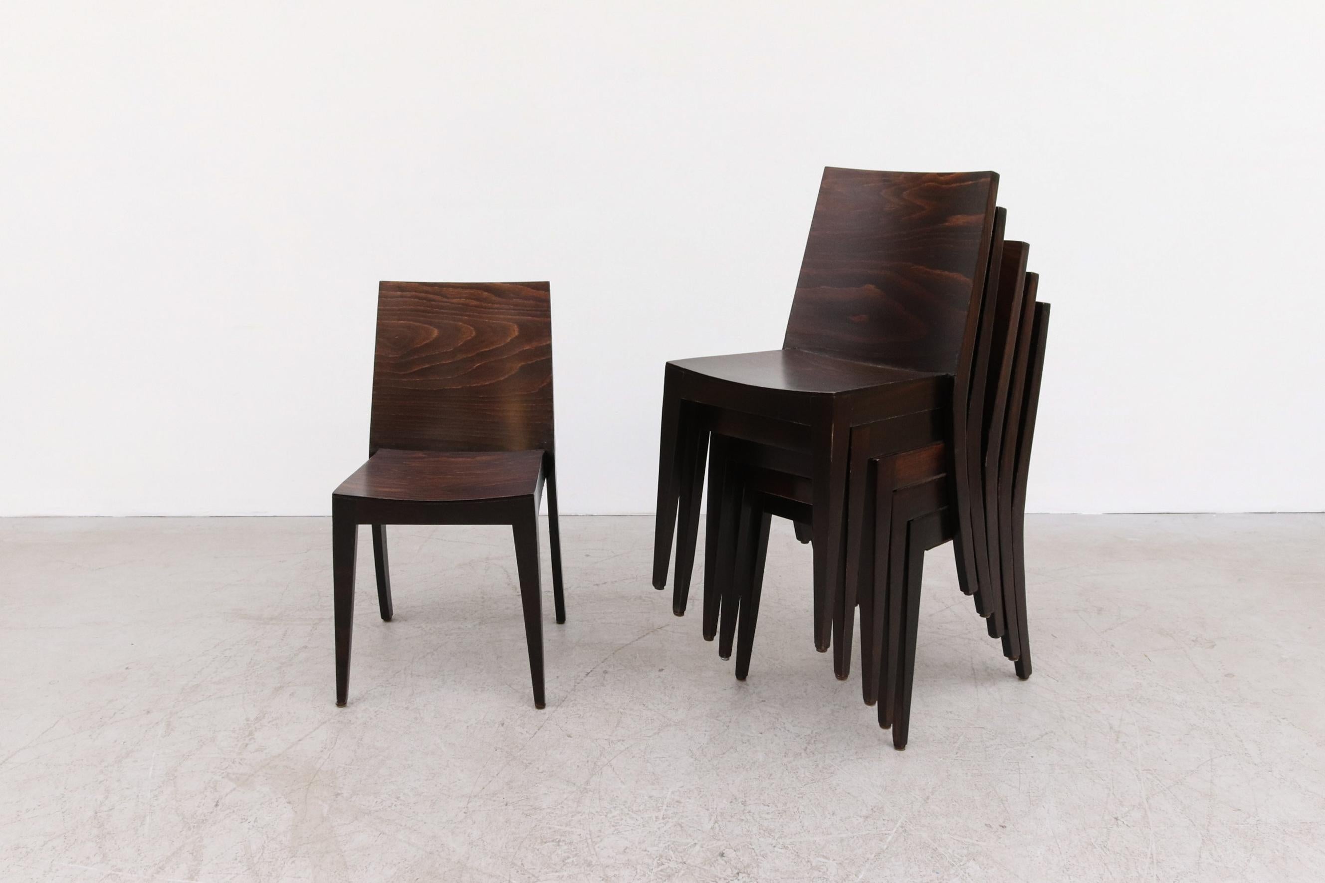 Philippe Starck Style Dark Stained Wood Stacking Chairs. Great architectural lines. In original condition with visible wear, including minor scratches and chips, consistent with age and use. Also available in a natural blonde version