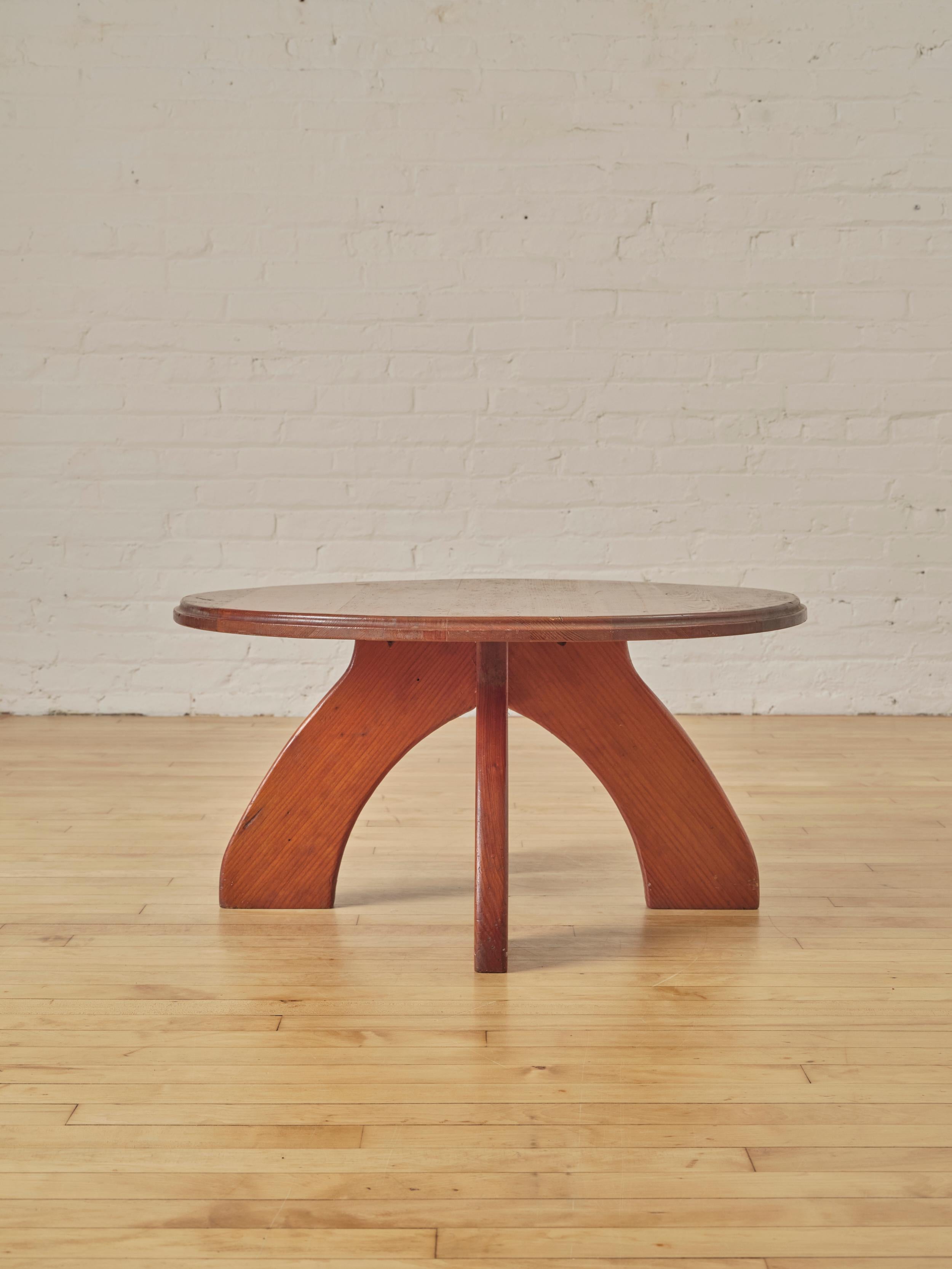 Modernist Pine Coffee Table with support from uniquely shaped irregular legs.

