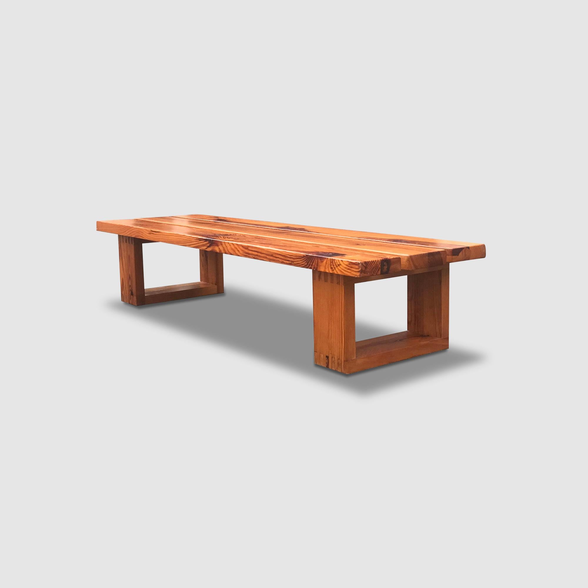 Pine slatted bench by Ate van Apeldoorn for Houtwerk Hattem.

In typical Van Apeldoorn fashion; built solid and with beautiful details, such as the wood connection on the feet.

The square shaped feet are connected to 3 long rectangular slats.

Very