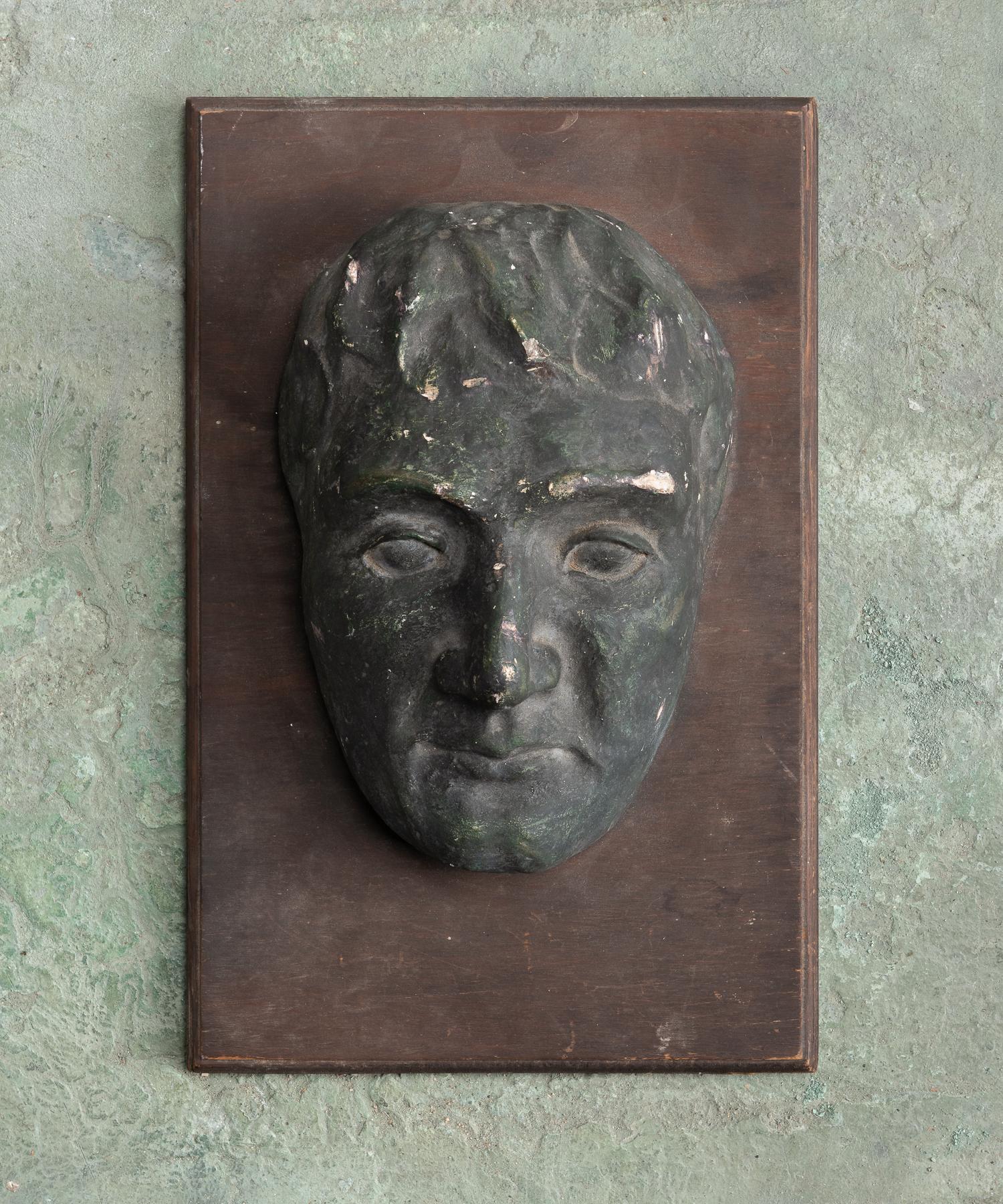 Modernist plaster bust, America, circa 1940.

Heavily patinated with original paint, mounted on wooden board. Originally from Providence College.

This pieces ships from Providence, Rhode Island.