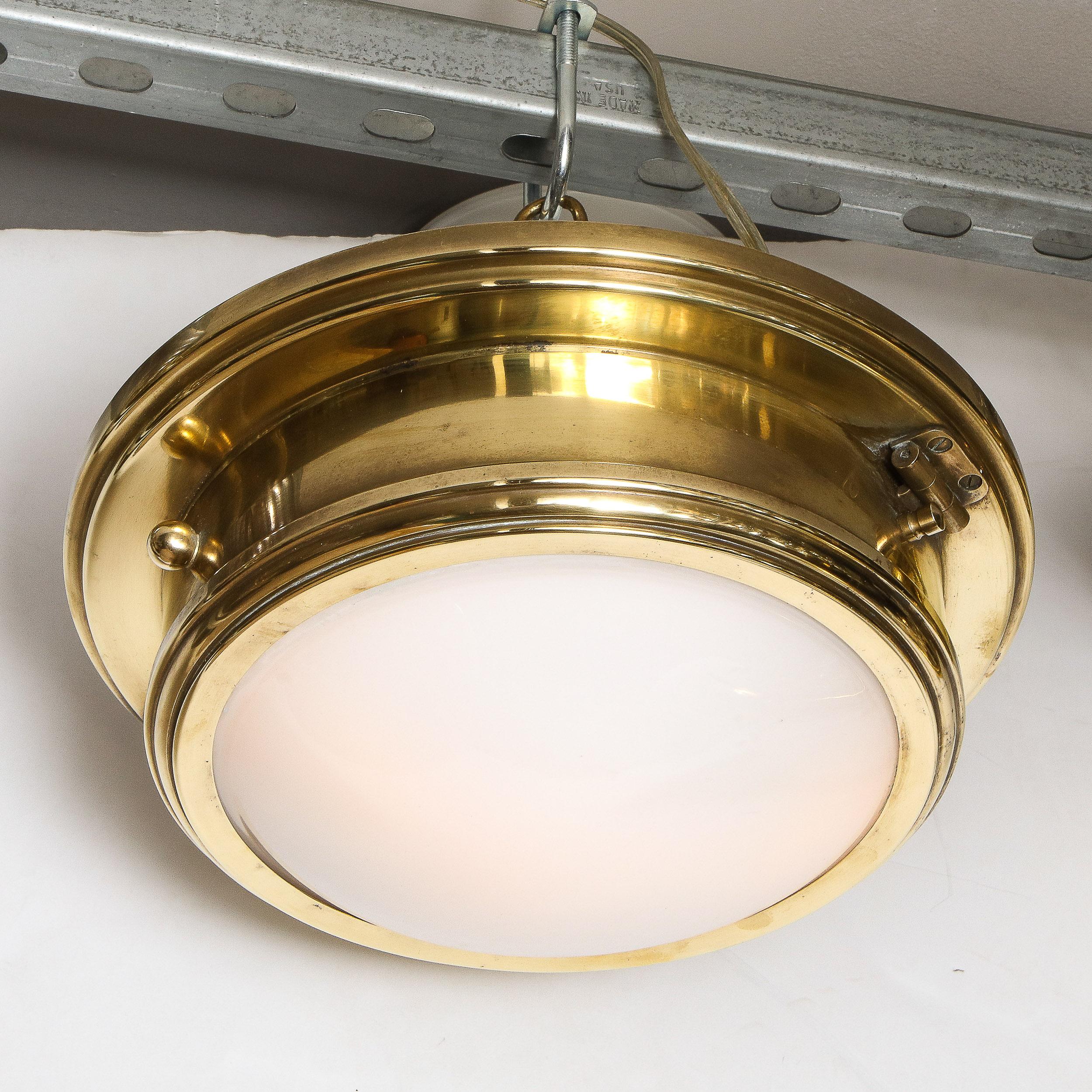 This refined modernist flush mount was realized by Ralph Lauren Home in the United States during the latter half of the 20th Century. The fixture offers a conical form with a stepped and channeled base that cantilevers slightly over the body of the