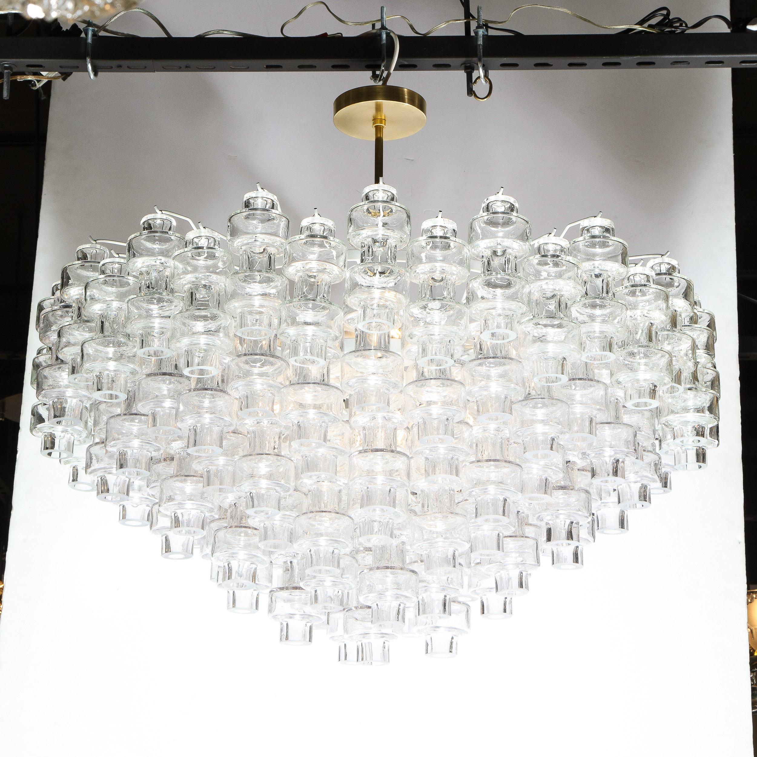 This outstanding Murano glass chandelier was realized in Murano, Italy- the island off the coast of Venice renowned for centuries for its superlative glass production. It features numerous translucent barbell shaped Murano glass shades hanging in a