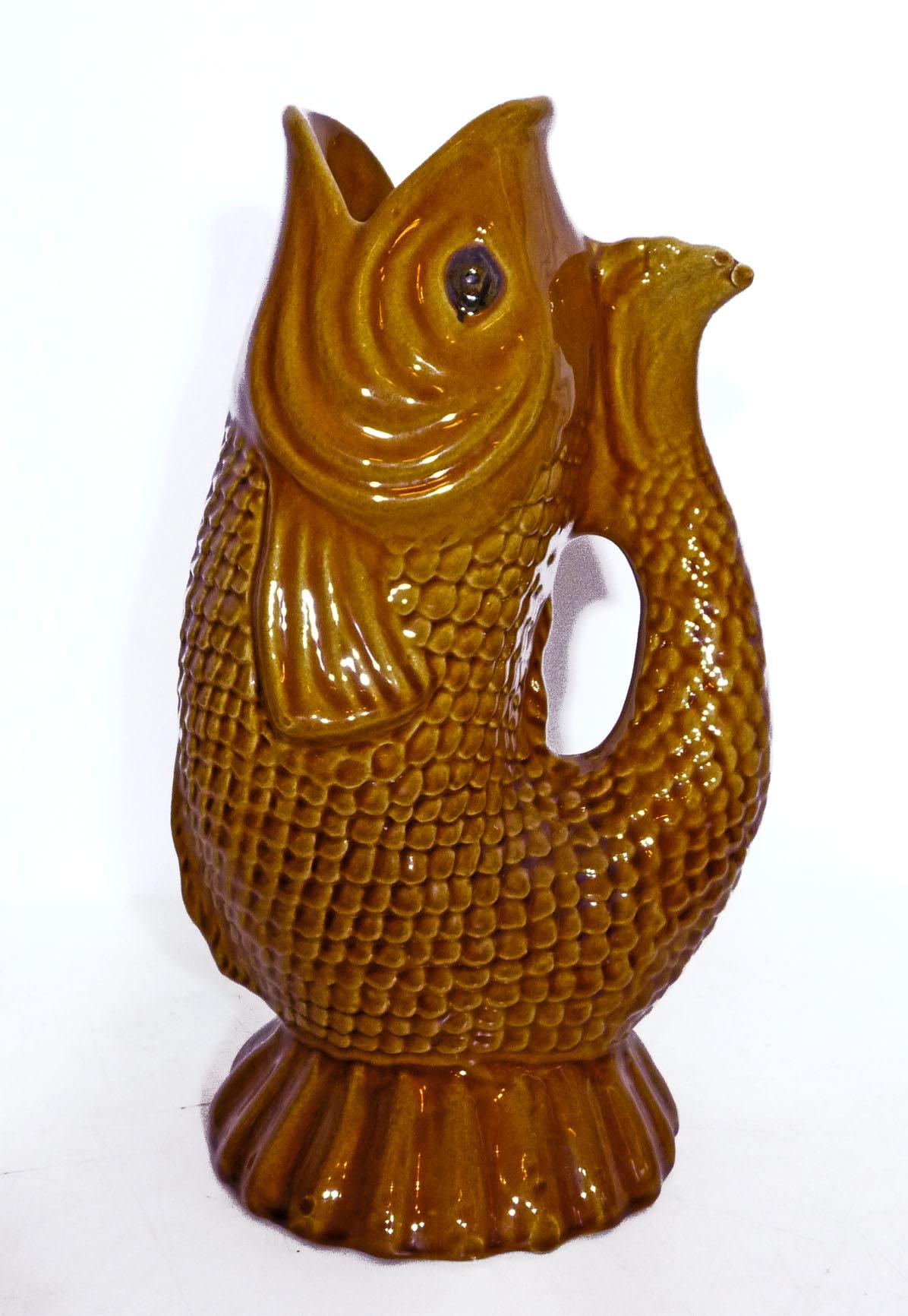 Modernist Portuguese Majolica amber glazed ceramic gurgle fish jug/tall pitcher
Glazed earthenware made in Portugal.

Measures: 
Height 12.6 in /32 cm
Width 8 in /20 cm
Deep 6 in / 15 cm
Weight 3.8 lb. (1.600 kg).
Cap 1.5 Lt.