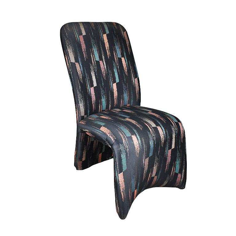 A fabulous set of six Postmodern dining chairs in black with a vertical stripe ikat pattern in pink, green, blue and yellow.

Each of these modern chairs has an undulating design with a slightly curved back with soft rounded corners which flow