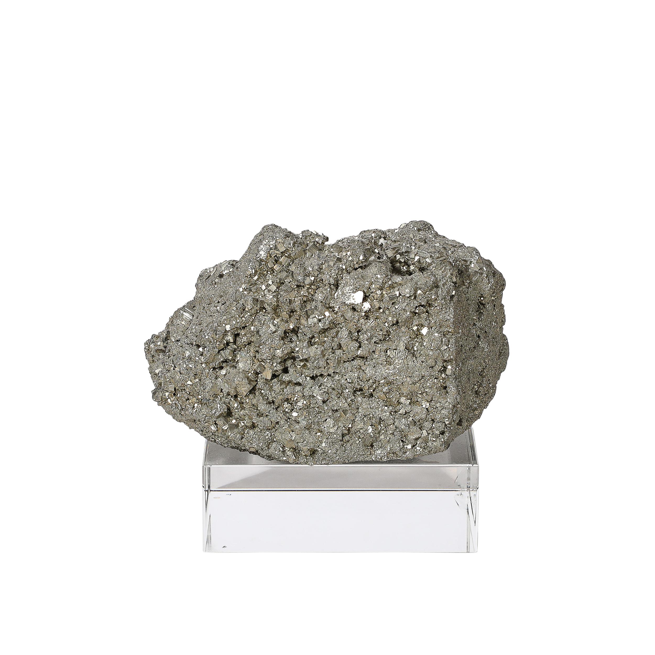 This glittering Modernist Pyrite Rock Specimen on Rectilinear Lucite Base originates from America, 20th Century. Features a beautiful natural cluster of Pyrite, which gets its name from the Ancient Greek word for fire, commonly used for centuries