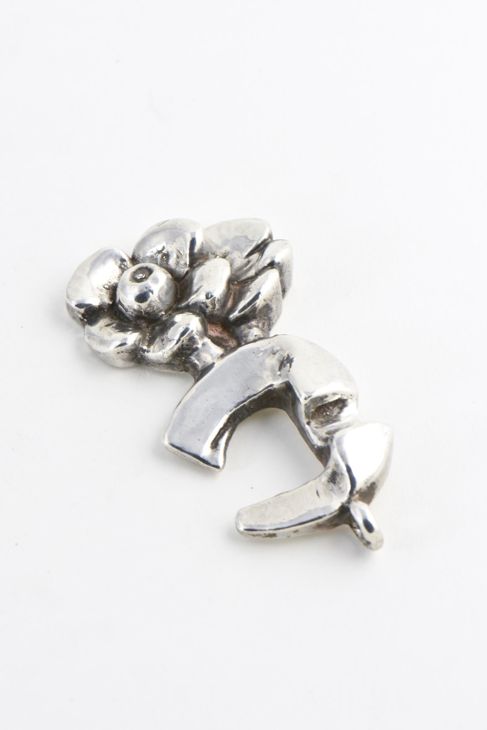 Sterling silver double-flower pendant designed by Israeli artist Rachel Gera. Signed on back: Rachel Gera 925.