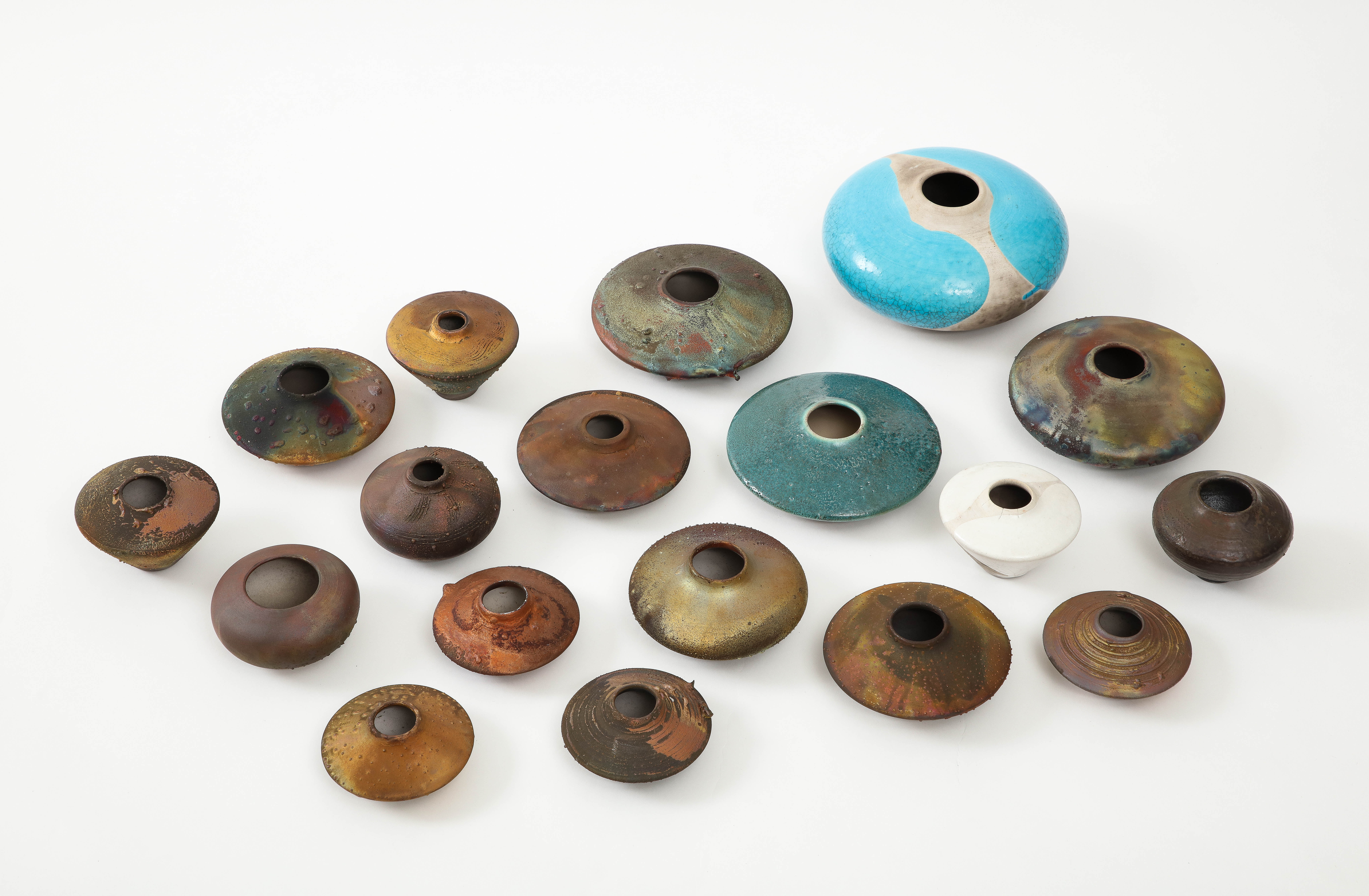 1970s-1990s modernist Raku pottery collection 0f 16 pieces by Woodstock, NY artist Norman Bacon.

Size varies the largest piece is 6.5'' diameter by 2.5'' height
The smallest piece is 4'' diameter by 2.75'' height.