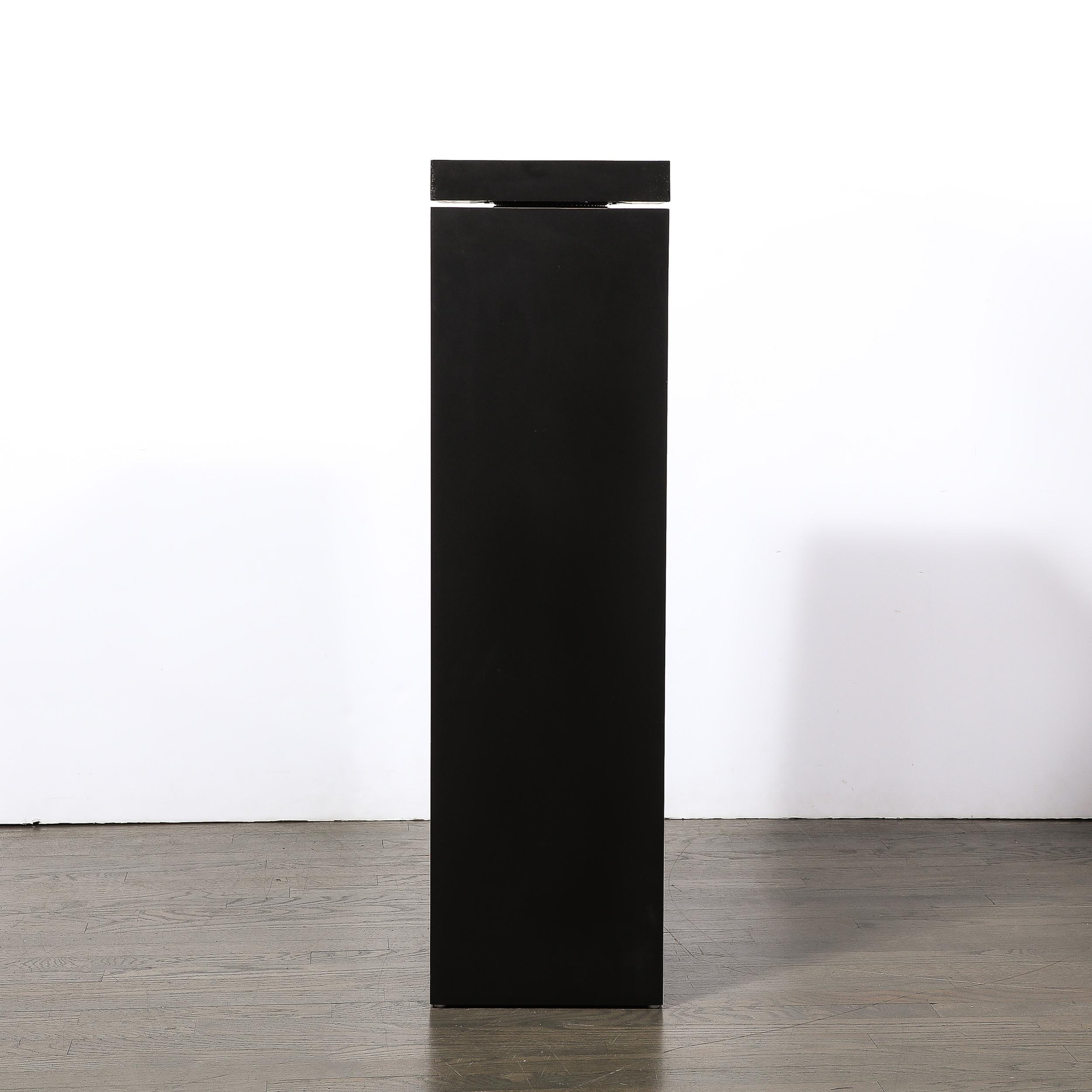 This minimal an highly functional Modernist Rectilinear Matt Black Swivel Top Pedestal Originates from the United States during the latter half of the 20th Century.  Features a minimal geometric form with a lovely proportioned divide between the