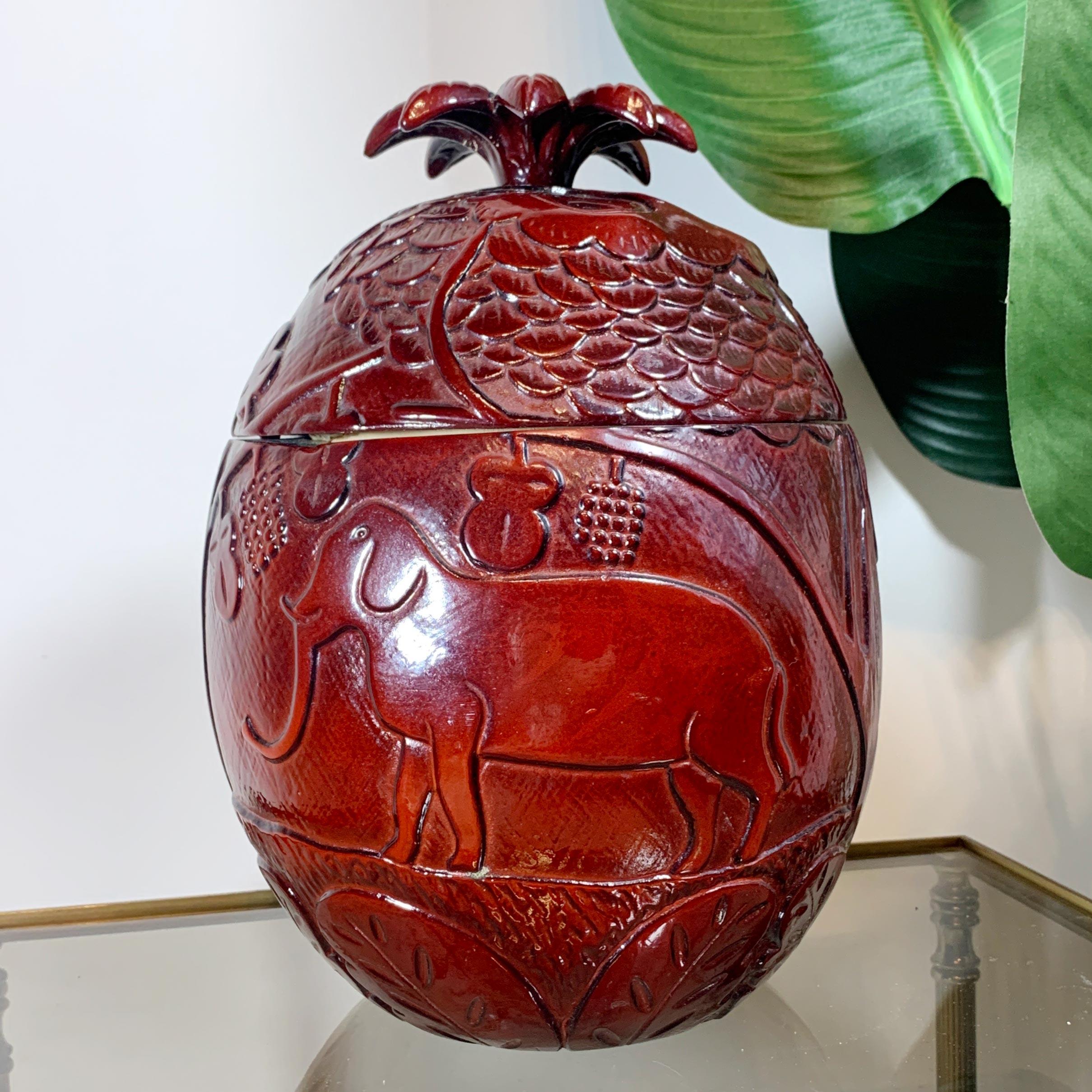 An exceptional and very rare resin modernist ice bucket, decorated in deep burgundy, attributed to the works of the pioneering modernist French artist Marc Chagall.

The ice bucket is adorned with various embossed images of deer, elephant, owl and