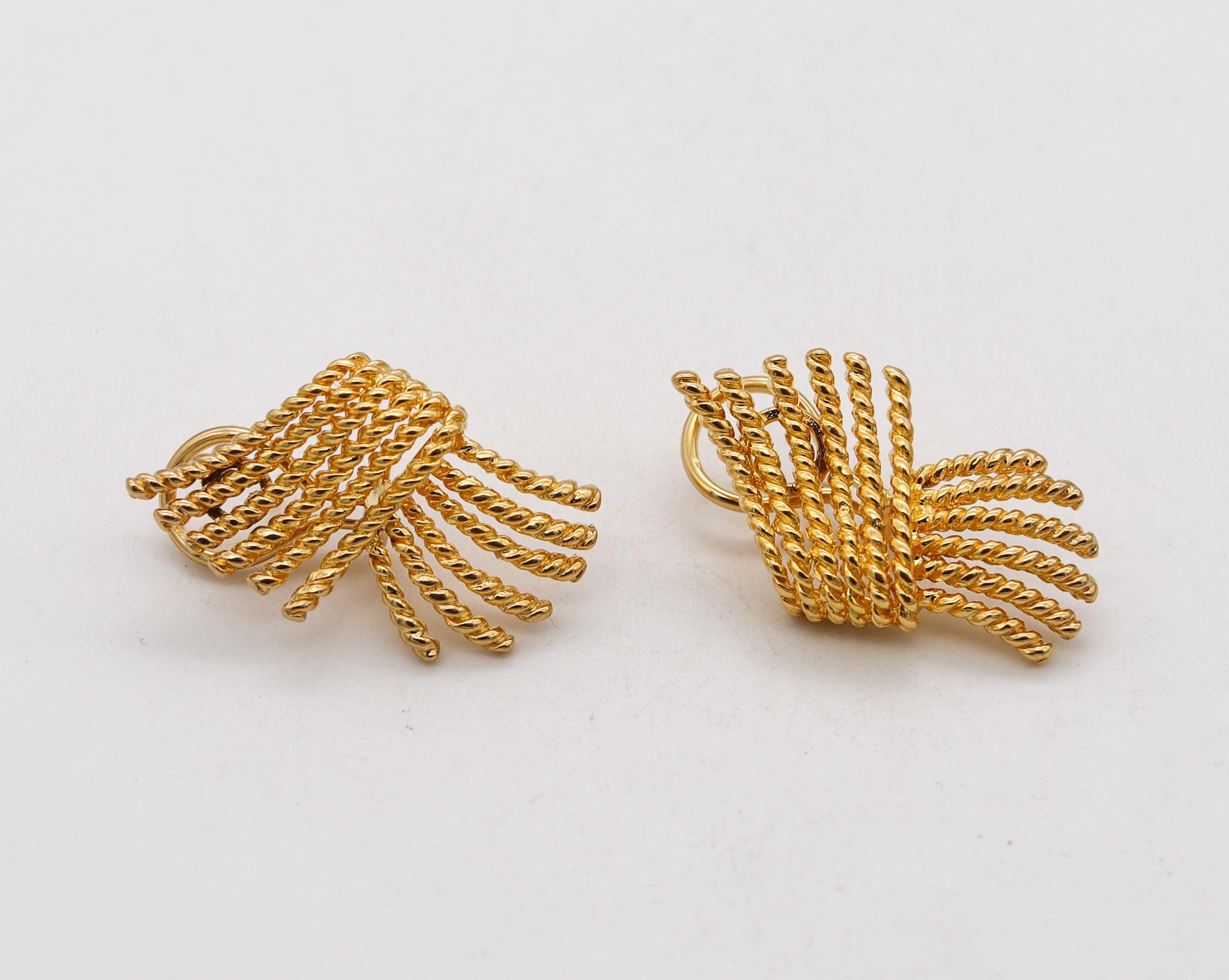 Pair of modernist twisted ropes earrings.

Beautiful modernist retro spiky pair of earrings, crafted in solid yellow gold of 18 karats, with textured rope patterns. Suited at the reverse, with poles for pierced ears (Removable) and French omega