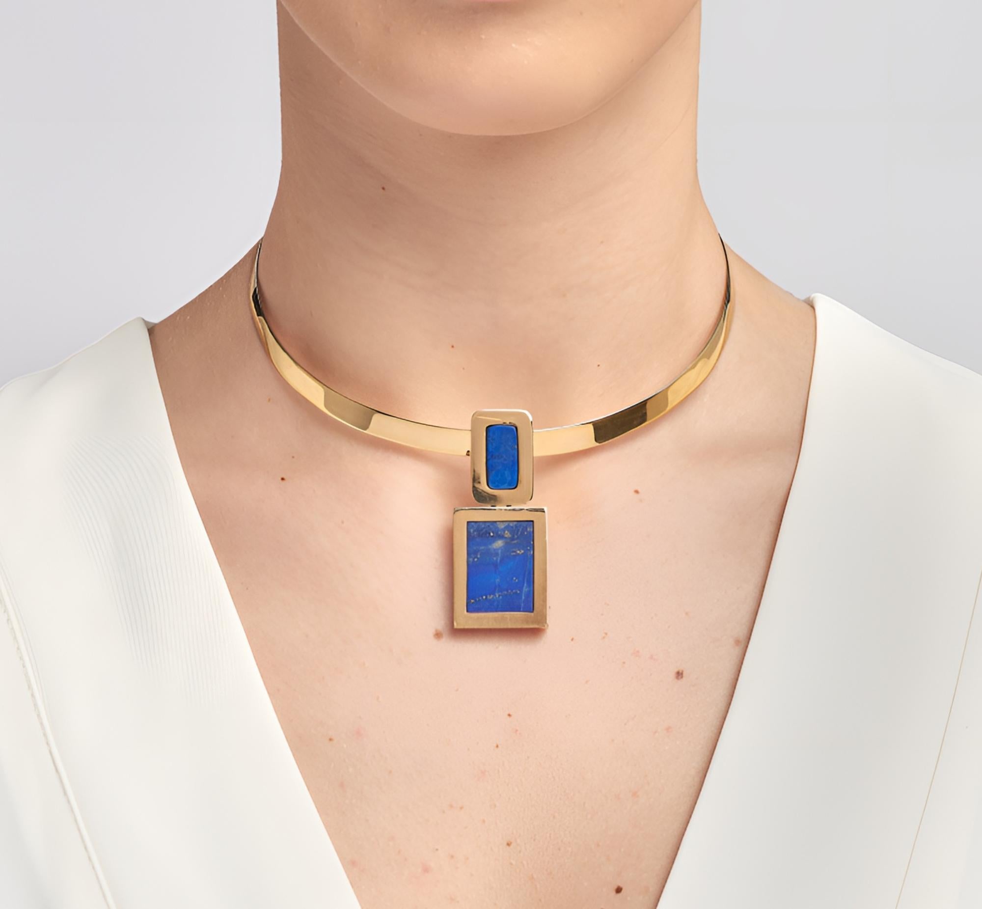 Modernist stylish design signed on the back Reyes 1973
Beautiful hand crafted as art piece of jewelry of solid 18 KT
With a flat and wide torque more suitable for a long slim neck and two geometric forms of substantial gold set with high quality