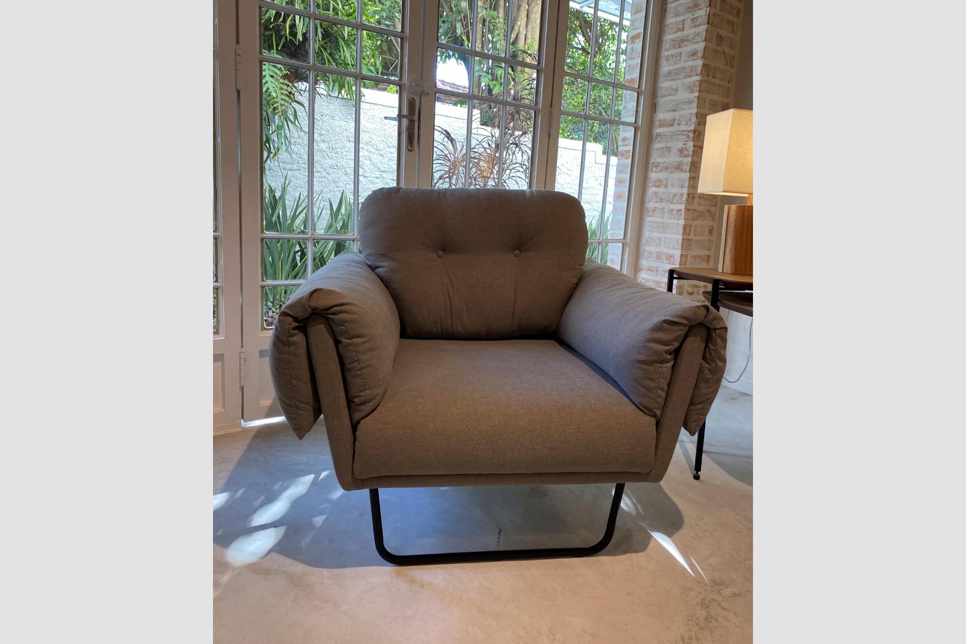 Velvet Modernist “Ro” armchair with ottoman upholstery For Sale