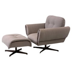 Modernist “Ro” swivel armchair with ottoman puff