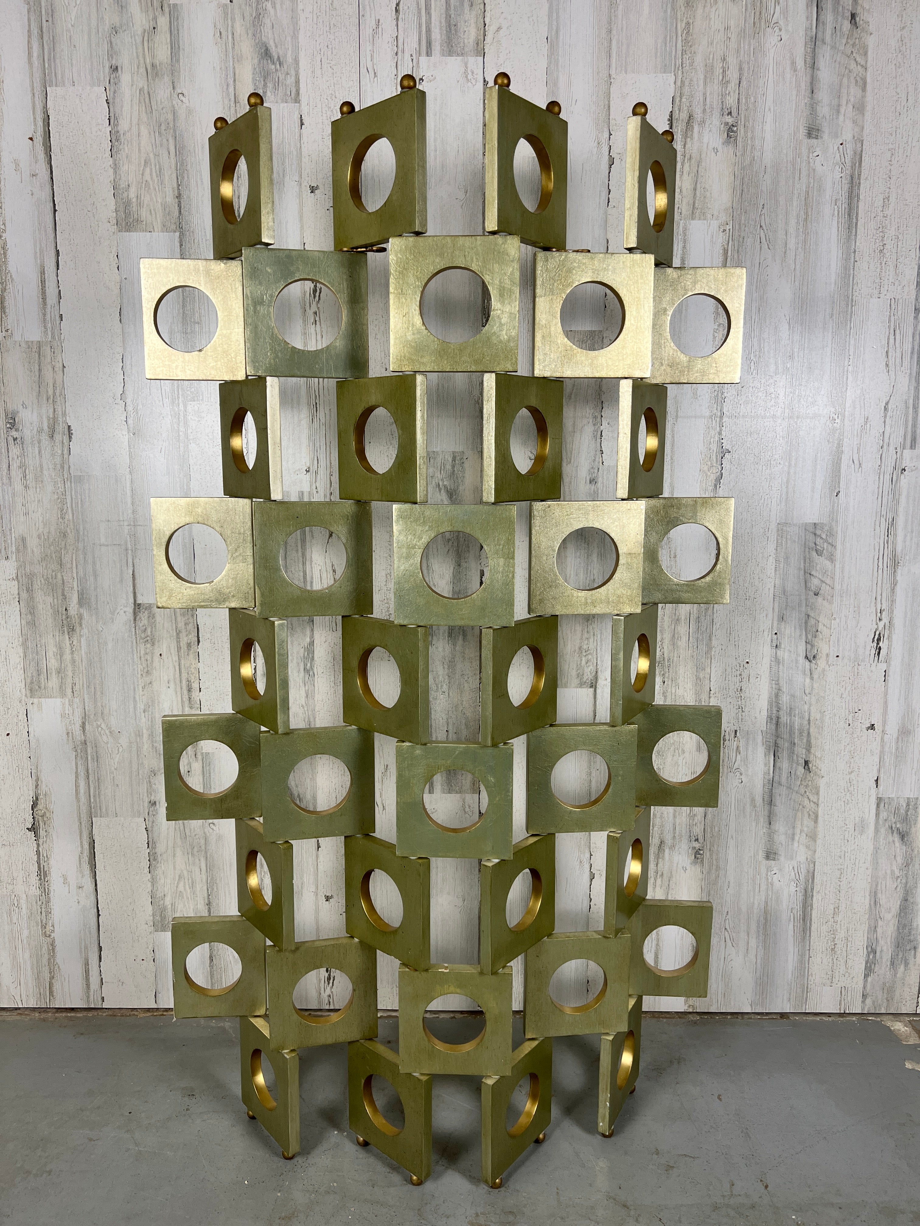 Miniature sized articulated screen in the style of Eileen Gray made of geometric shaped wood with silver leaf and metal ball accents. Finished on both sides.