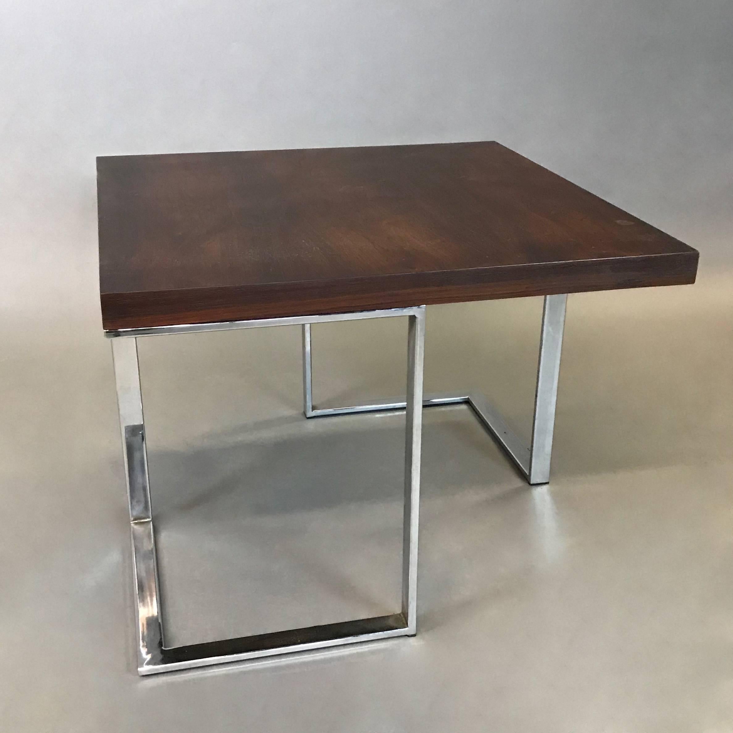 Striking, modernist coffee or side table features a rosewood top with architectural chrome bases is very much in the style of Milo Baughman.
