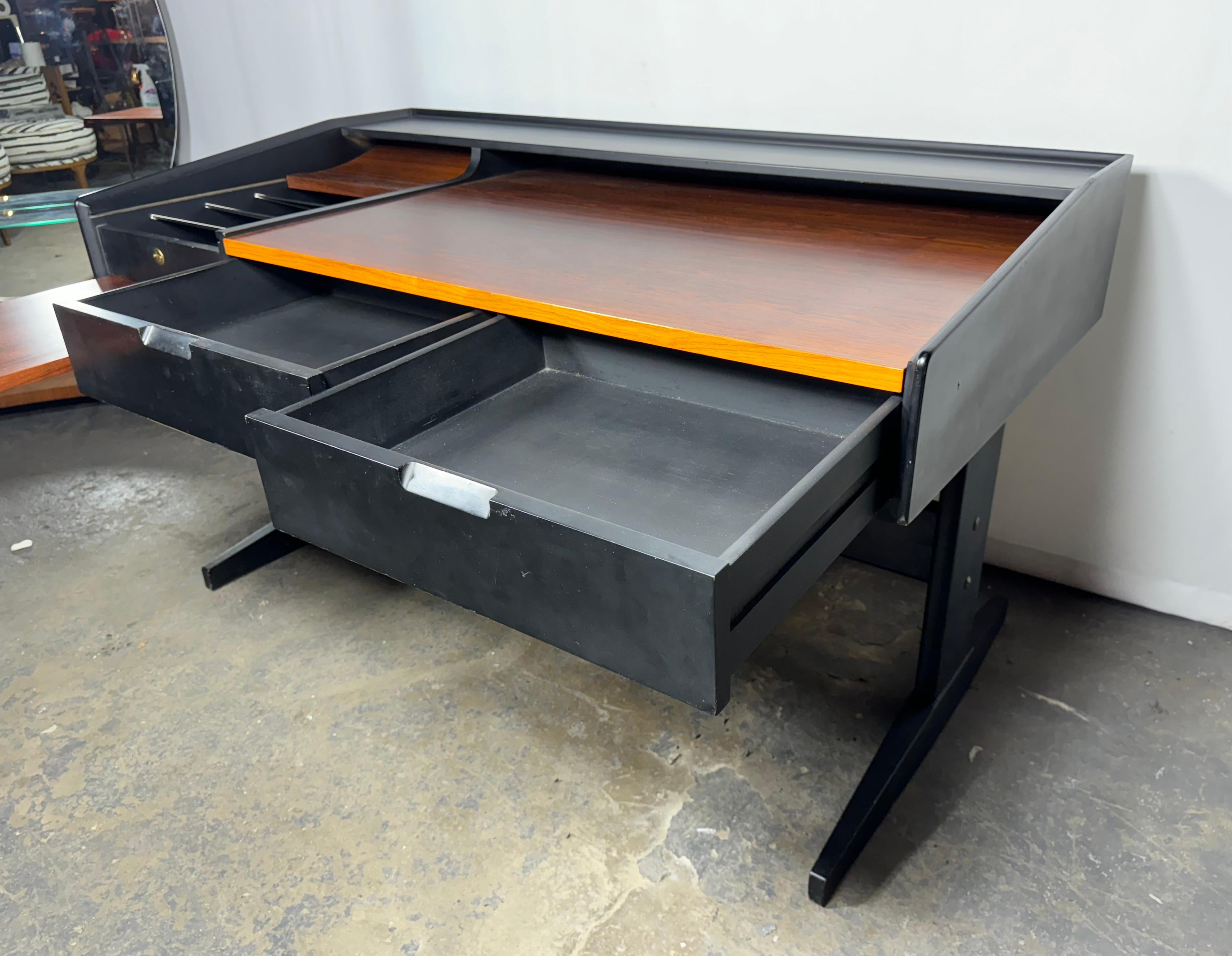 Stunning Rosewood and Lacquered Desk,, Beautiful richly grained rosewood,Very  Unusual design.!  Locking File drawer revealed when left drawer (tray table) opens.. (see video). Unfortunately NO key. Top writing / work surface  also slides forward
