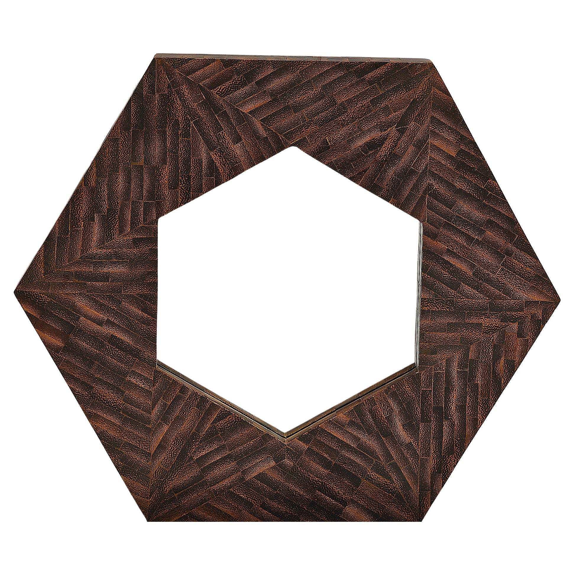 Unknown artist of a unique modernist solid rosewood wall mirror with five sides. Pristine mirror center, circa 1950s. Although the artist is unknown, we believe the origin of this piece is from Italy as the trend for octagonal-shaped mirrors during