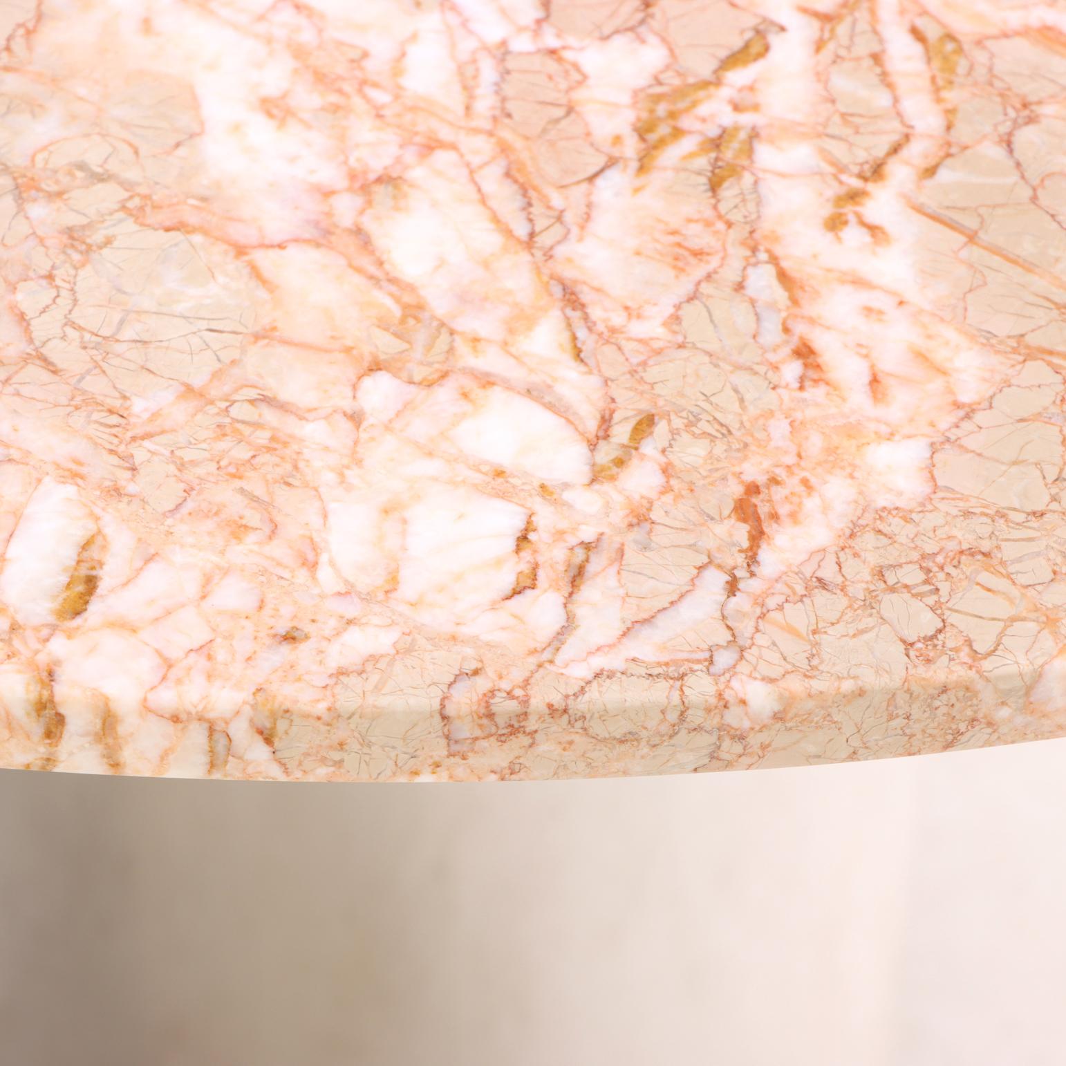 Round dining table attributed to Breuton, crafted in the 2010s. The top is Breccia Oniciata marble with distinctive orange, rose, and cream veining over a beige field, paired with a polished chrome cylindrical pedestal base. A striking combination