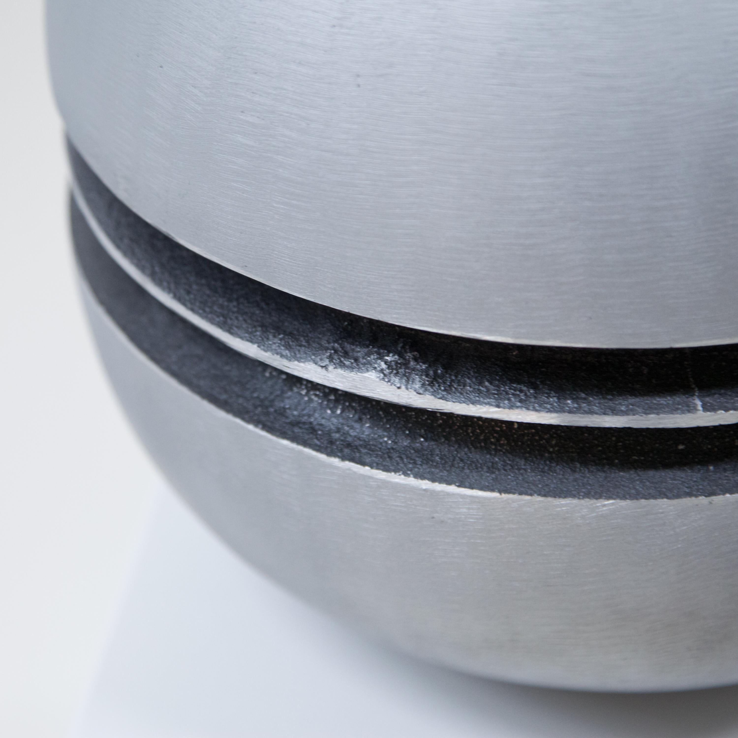 A sculptural Modernist round vase
by artist Lorenzo Burchiellaro.
Textured cast aluminum. 
Signed underneath Burchiellaro.
 