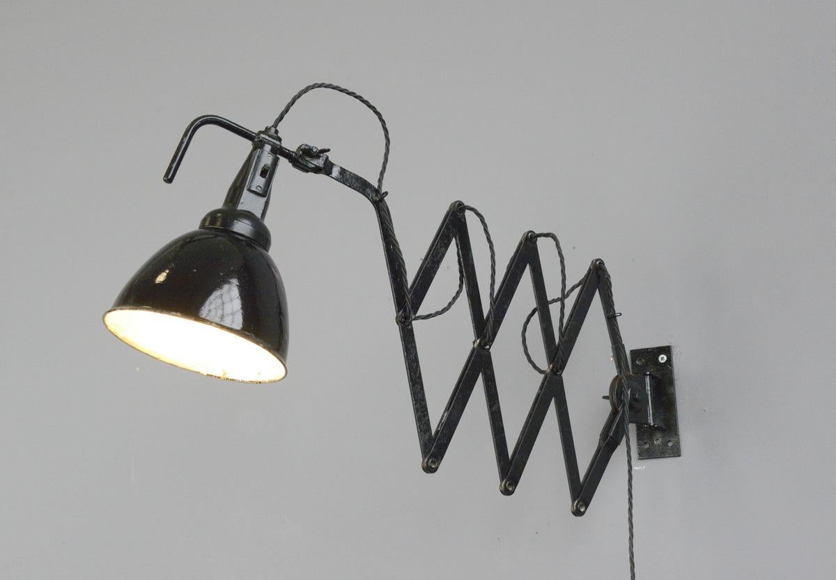Modernist scissor lamp by Wilhelm Bader, circa 1930s

- Large extendable scissor mechanism 
- Original On/Off switches 
- Takes E27 fitting bulbs
- German ~ 1930s
- Extends up to 115cm from the wall
- Measures: 18cm wide x 25cm