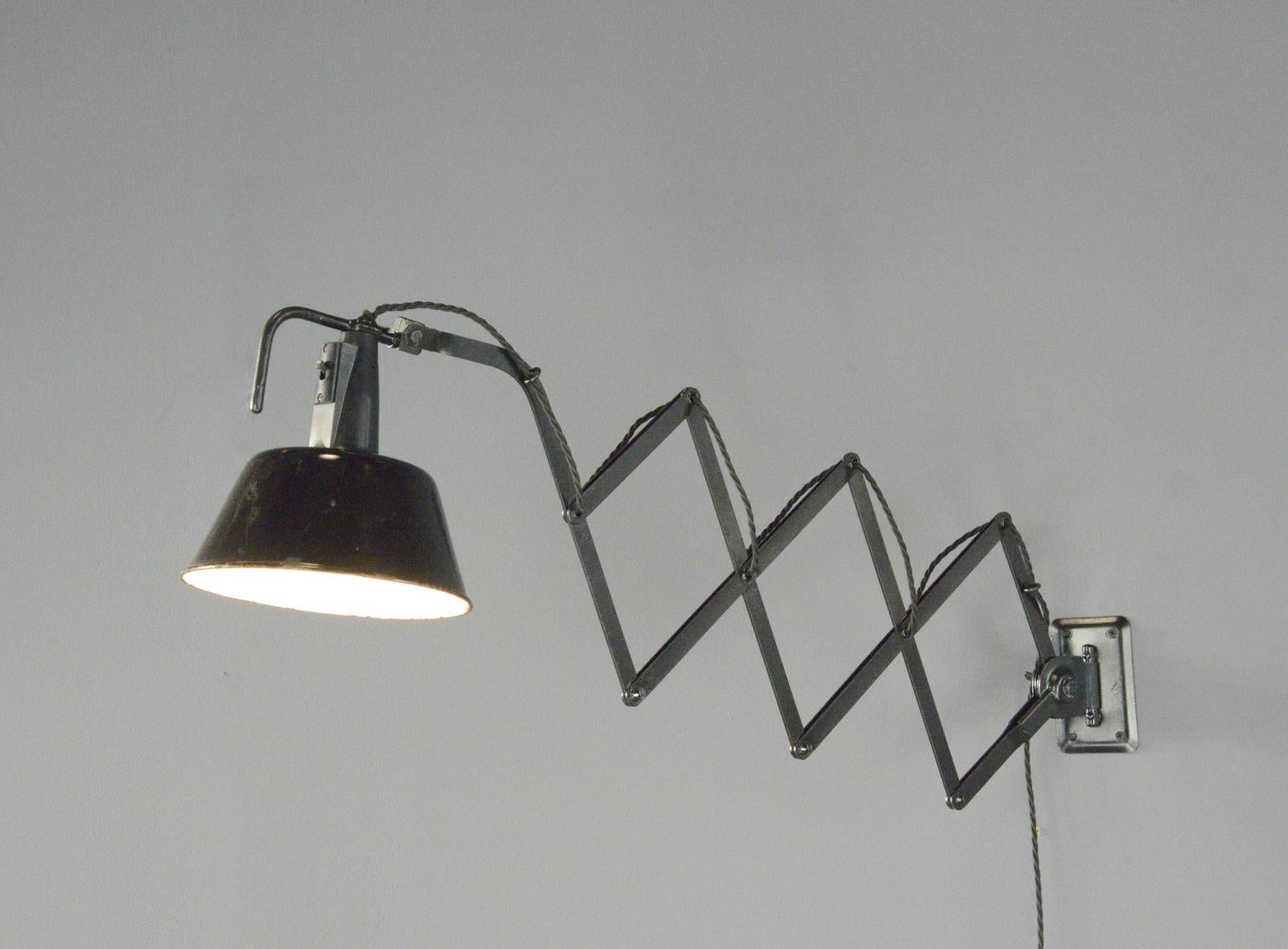 Modernist Scissor Lamp By Wilhelm Bader Circa 1930s

- Large extendable scissor mechanism 
- Original On/Off switch
- Takes E27 fitting bulbs
- German ~ 1930s
- Extends up to 115cm from the wall
- 18cm wide x 25cm tall

Condition Report

Fully re