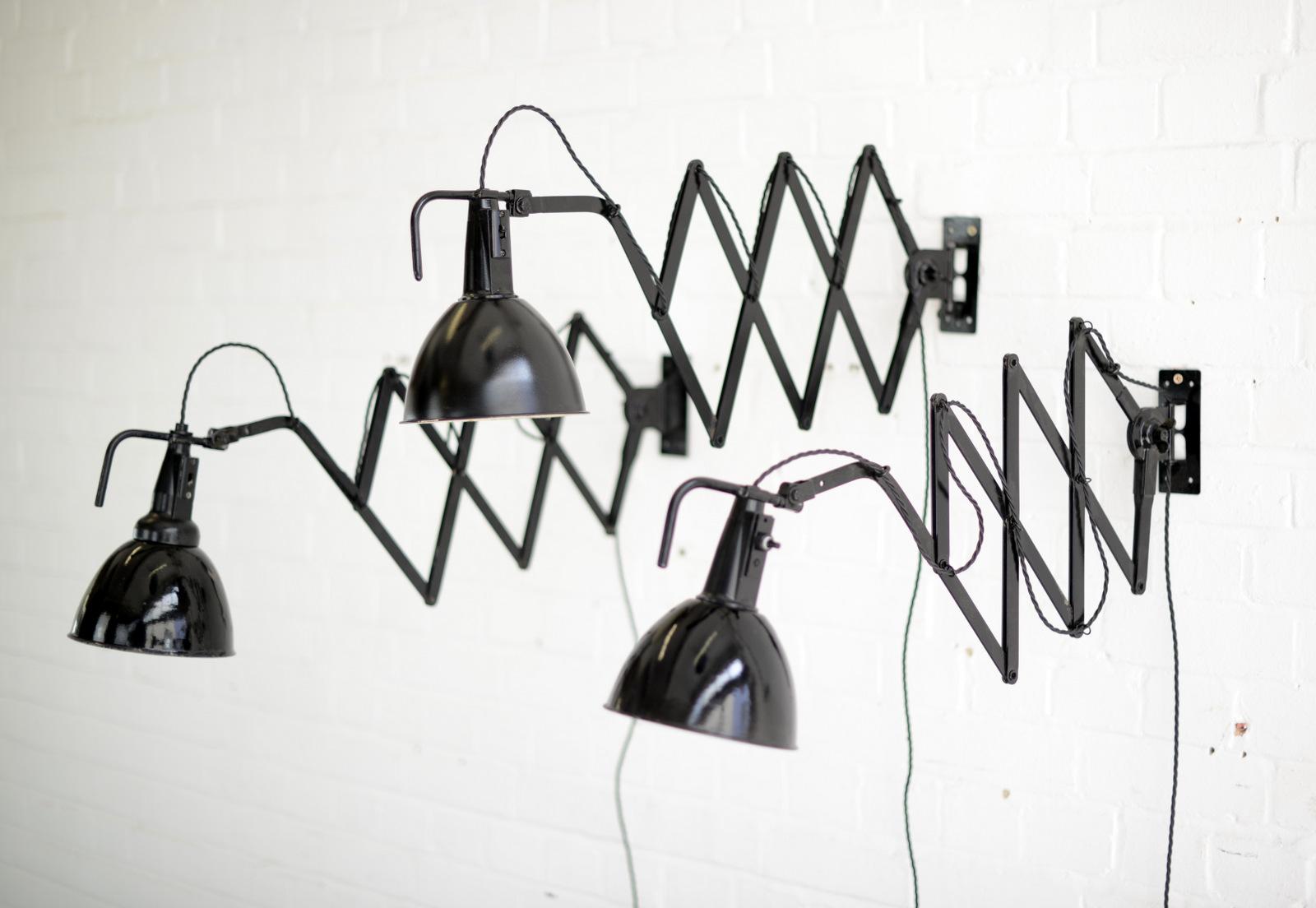 Modernist scissor lamps by Wilhelm Bader, circa 1930s

- Price is per light
- Large extendable scissor mechanism 
- Original On/Off switches 
- Takes E27 fitting bulbs
- German ~ 1930s
- Extends up to 115cm from the wall
- 18cm wide x 25cm