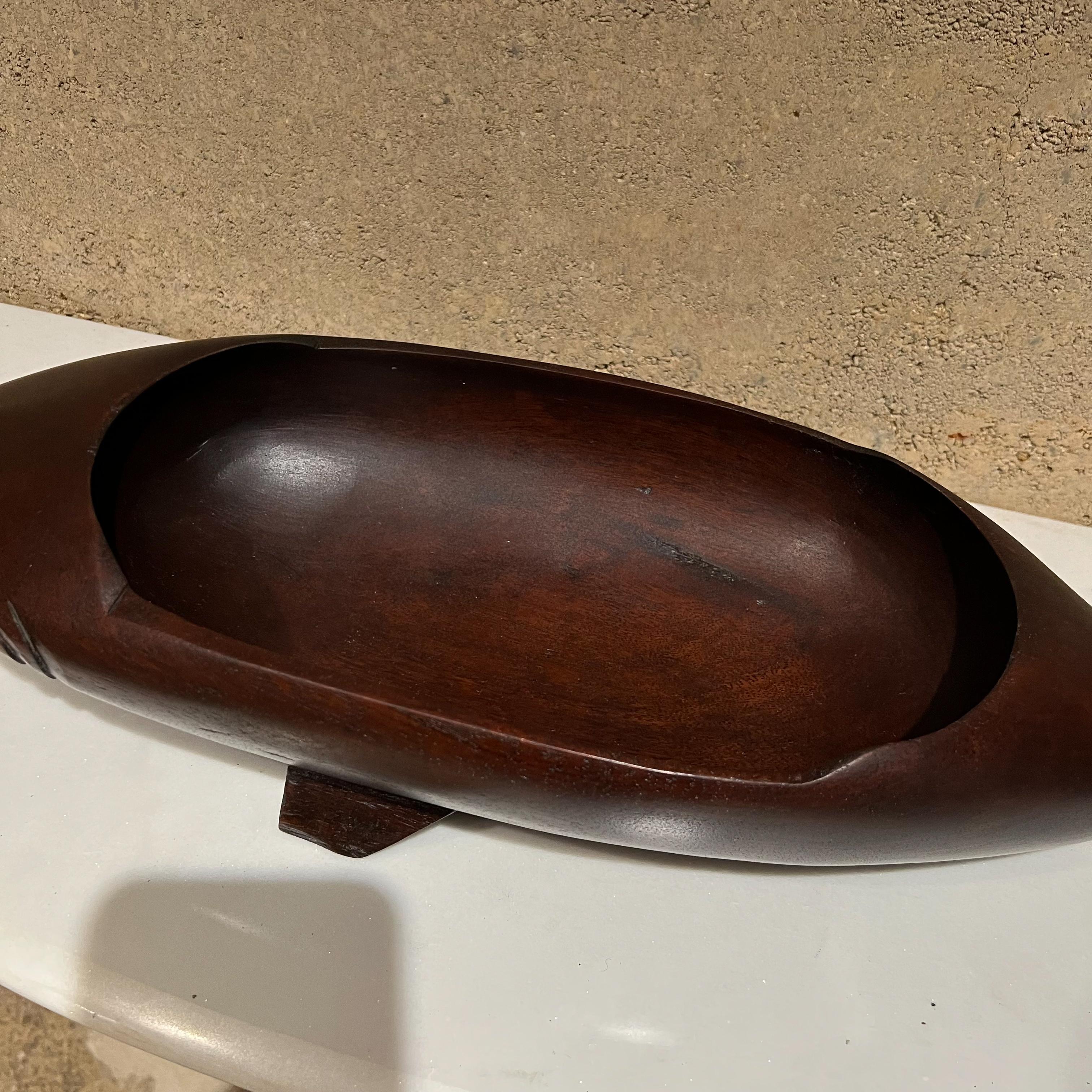 Shark bowl
Modernist sculpted wood shark bowl catchall dish
Measures: 3.75 tall x 7.5 w x 24 l inside bowl 6.75 x 12.75
Preowned unrestored vintage condition
See images provided.
  