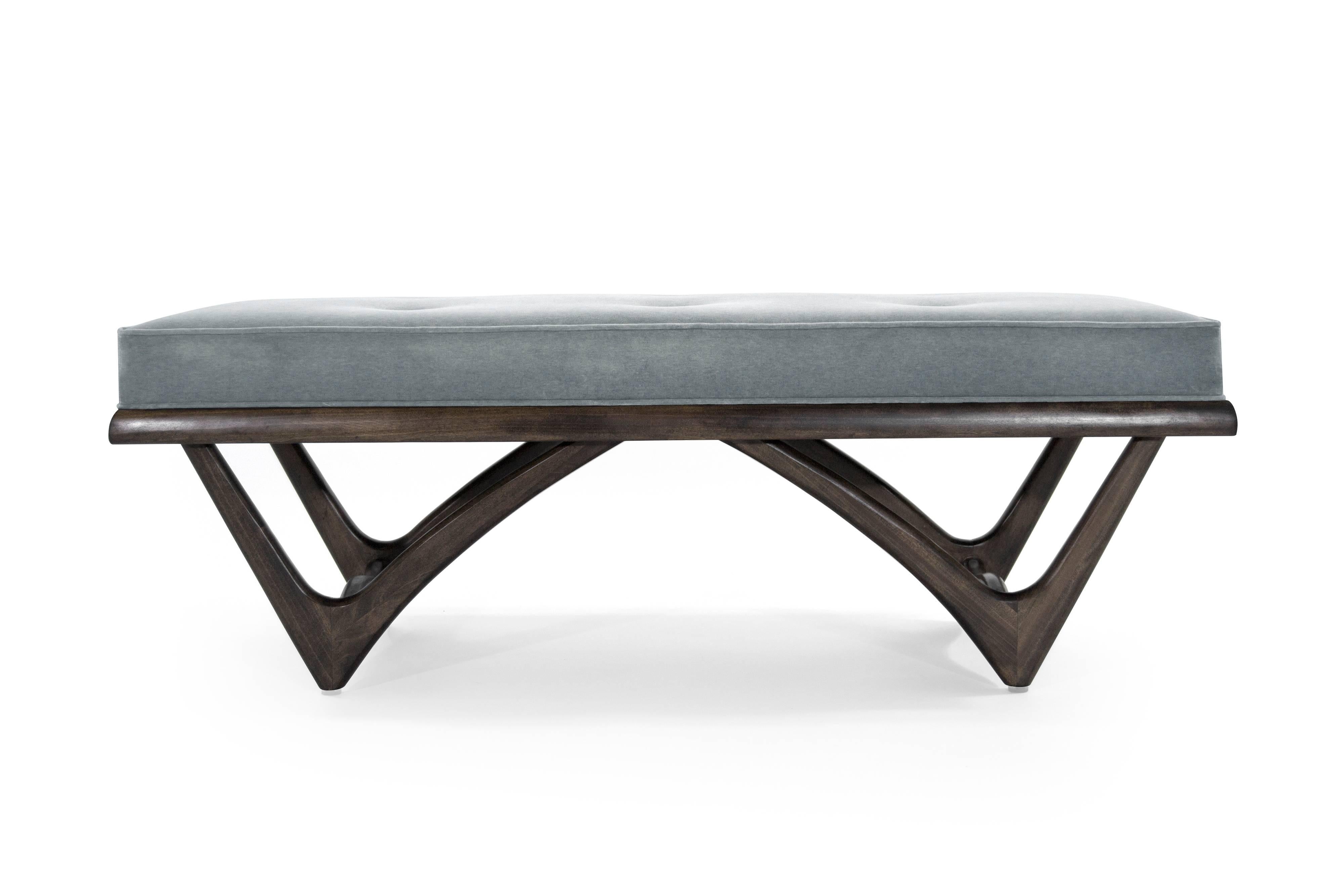 Mid-Century Modern bench in the style of Adrian Pearsall, sculptural walnut base fully restored to it original medium walnut tone. Top newly upholstered in grey or blue velvet.