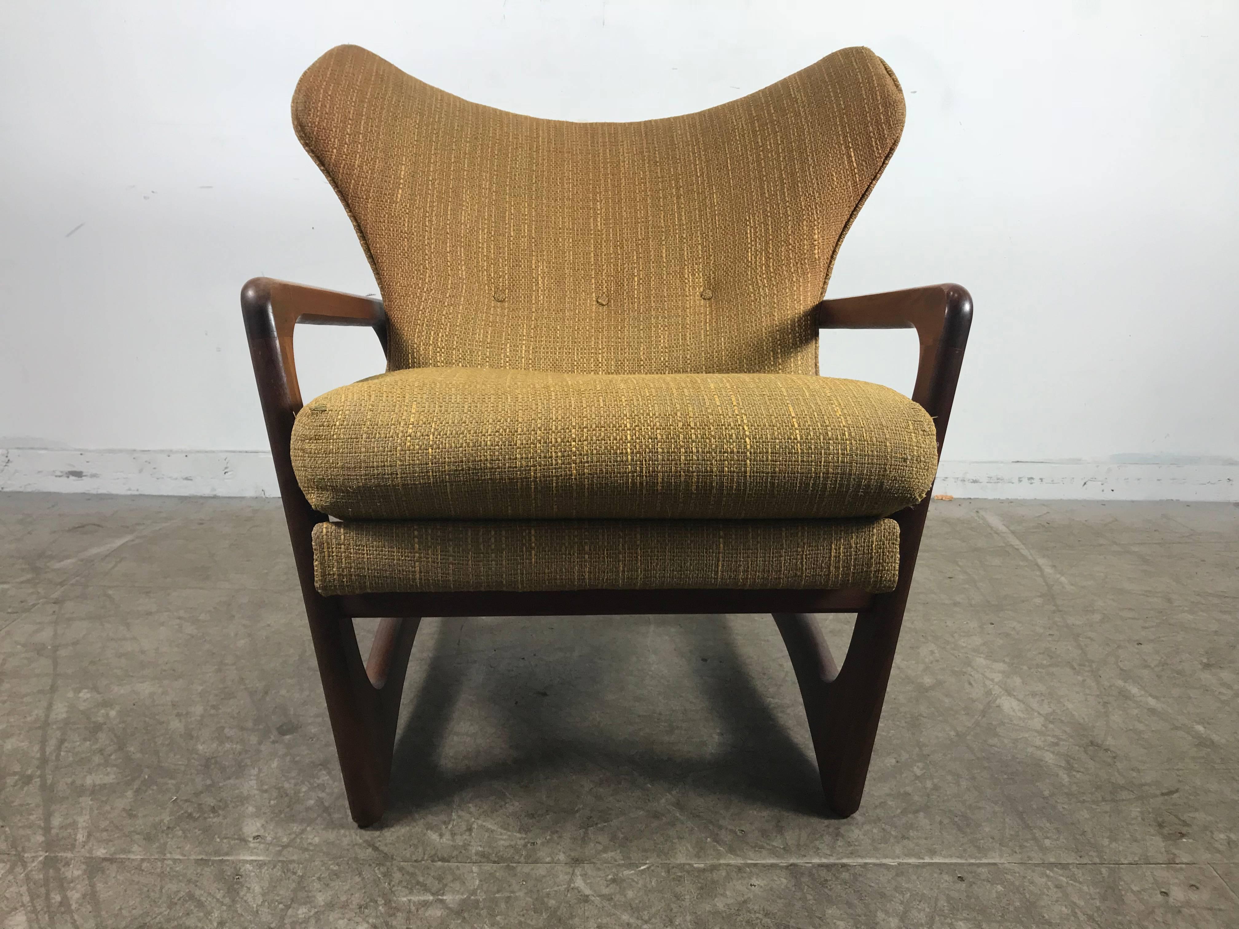 Modernist sculptural walnut wingback lounge chair by Adrian Pearsall, beautifully sculpted walnut wood frame. Exaggerated elephant ear wingback. Retains original fabric, extremely comfortable Classic Mid-Century Modern, a chair and a sculpture.