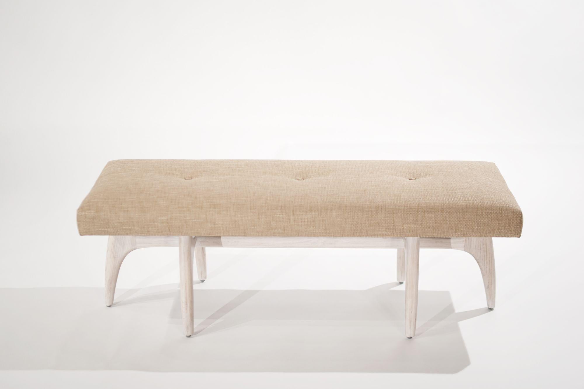 Introducing the Odyssey Bench by Stamford Modern, a captivating fusion of sculptural artistry and impeccable craftsmanship. Constructed from solid oak or walnut, this bench exudes both durability and timeless elegance. With seven versatile finishes