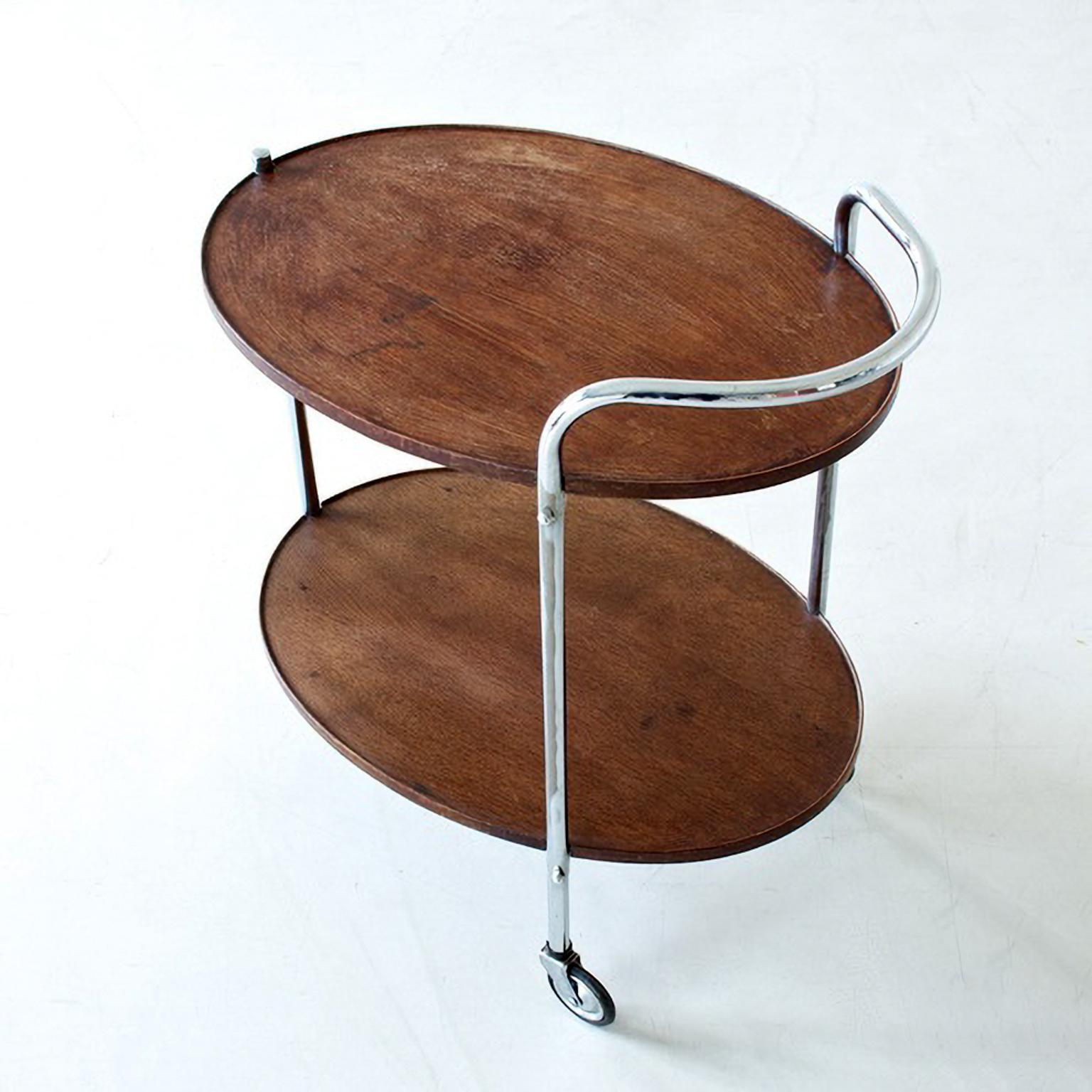Stained Modernist Serving Trolley with Two Oval Wooden Shelves Chromed Metal, circa 1930 For Sale