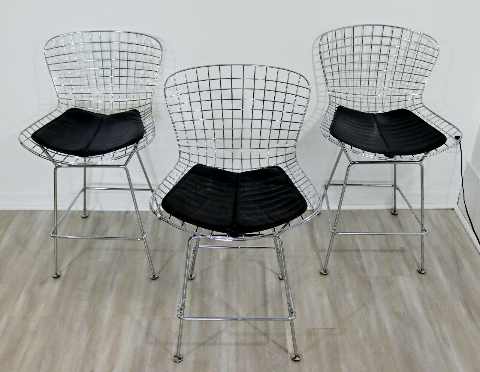 For your consideration is a wonderful set of three, chrome wire bar stools, with original vinyl seats, In the style of Harry Bertoia. In excellent condition. The dimensions are 21.5