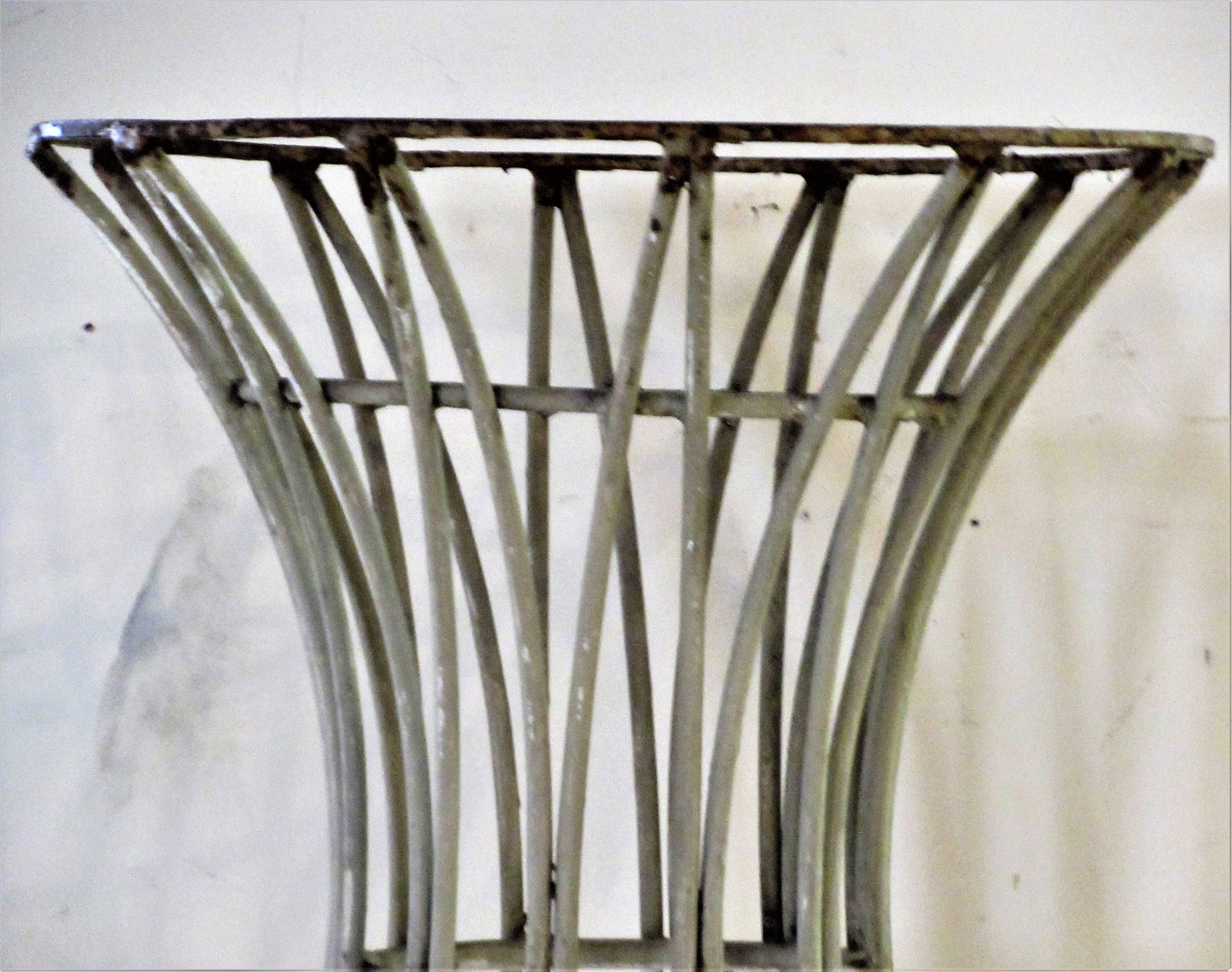 Mid-20th century sheaf of wheat style iron table base in aged old putty white painted surface with areas of rust and paint loss. Beautiful sculptural quality. Table base measures 18 1/2 inches across top / 25 1/2 inches across bottom x 26 3/4 inches