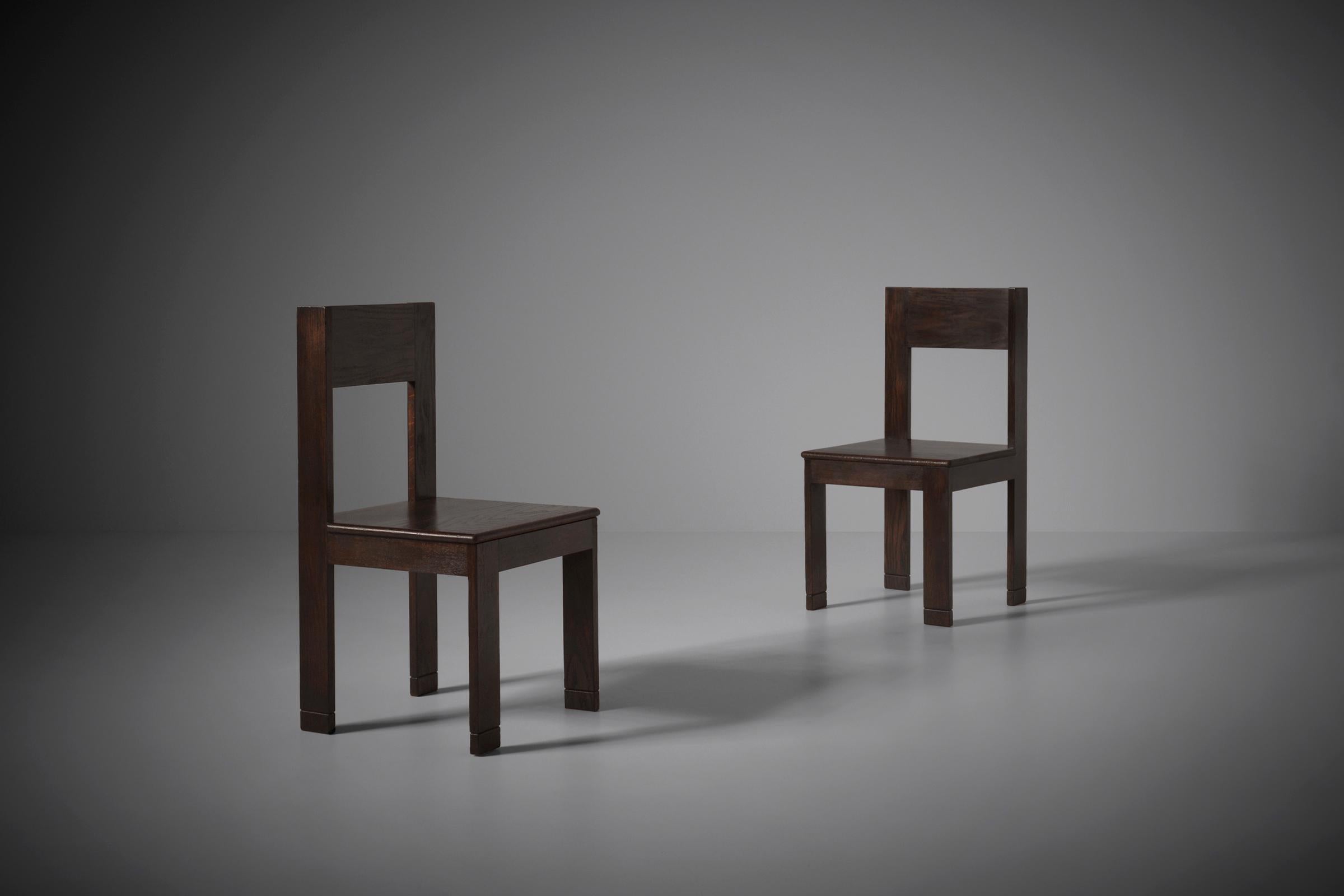 Rare pair of modernist side chairs by L.O.V. Oosterbeek, the Netherlands 1921. L.O.V. is an abbreviation of Labor Onia Vincit which means 'Work conquers all'. Designed most probably by Fritz Spanjaard who became the artistic director of L.O.V. in