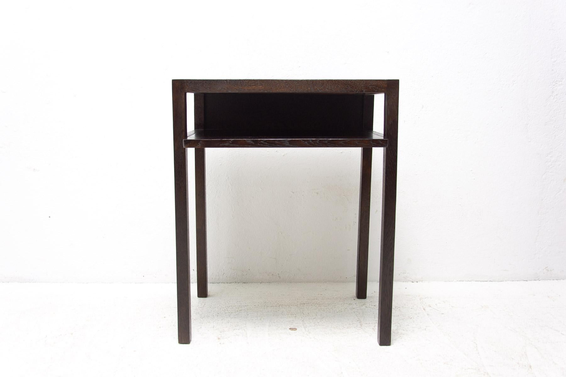 This Modernist piece was originally designed as a table for holding a radio with an adjustable shelf for newspapers or books. The table was produced in the 1930s by the renown UP Brno and designed by Jindrich Halabala.
The table has a very