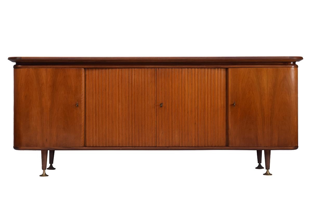 This walnut veneered sideboard was designed by the Dutch modernist A. A. Patijn and manufactured by Zijlstra Joure in the 1950s. A. A. Patijn loved the combination of combining Classic form with a modern style. Timeless Dutch design still in it's