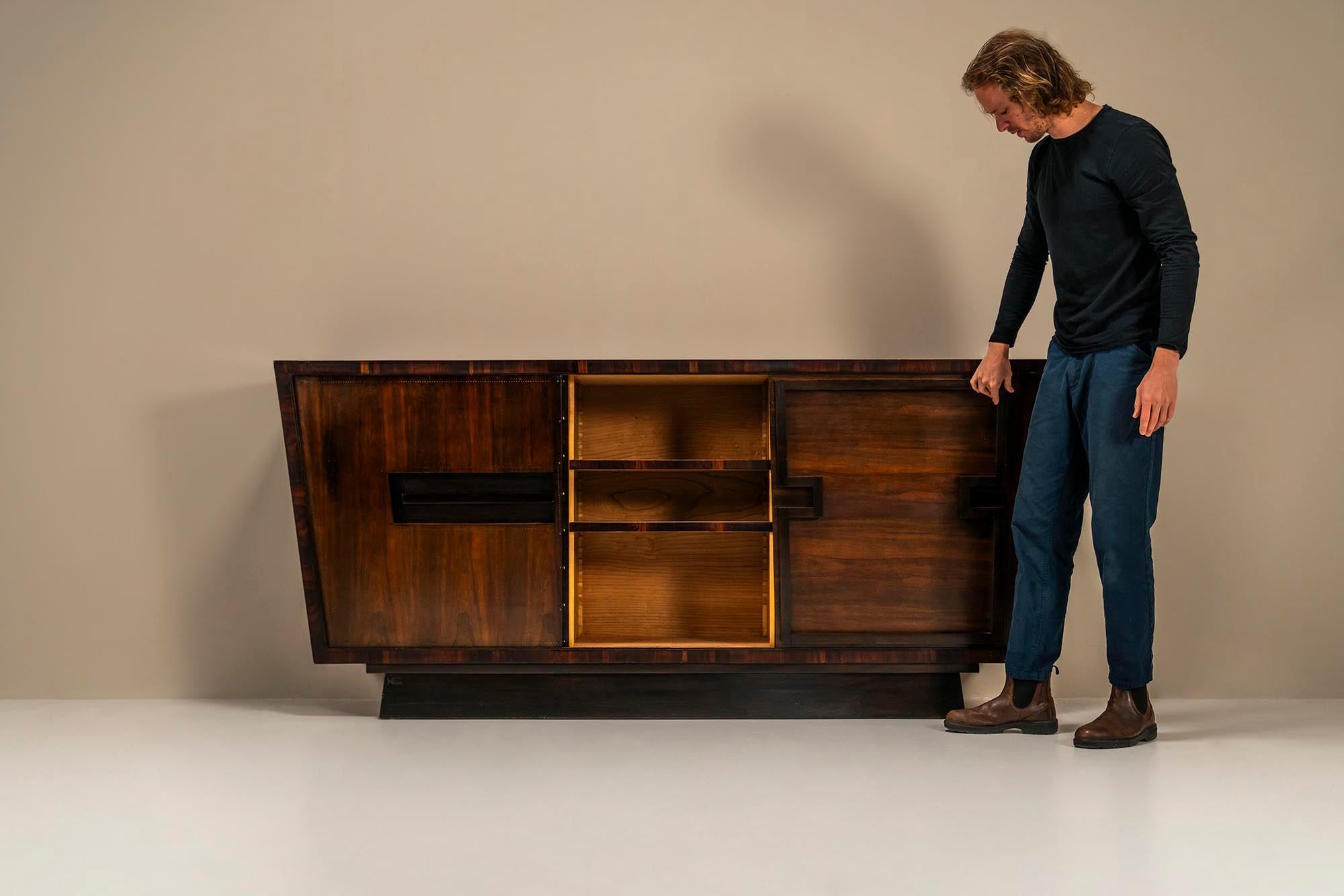 Modernist sideboard in studded rosewood by Andre Sornay.Andre Sornay was an extremely gifted furniture designer who belonged to the absolute avant-garde both conceptually and artistically. As an exponent of the Art Deco style, he had a major