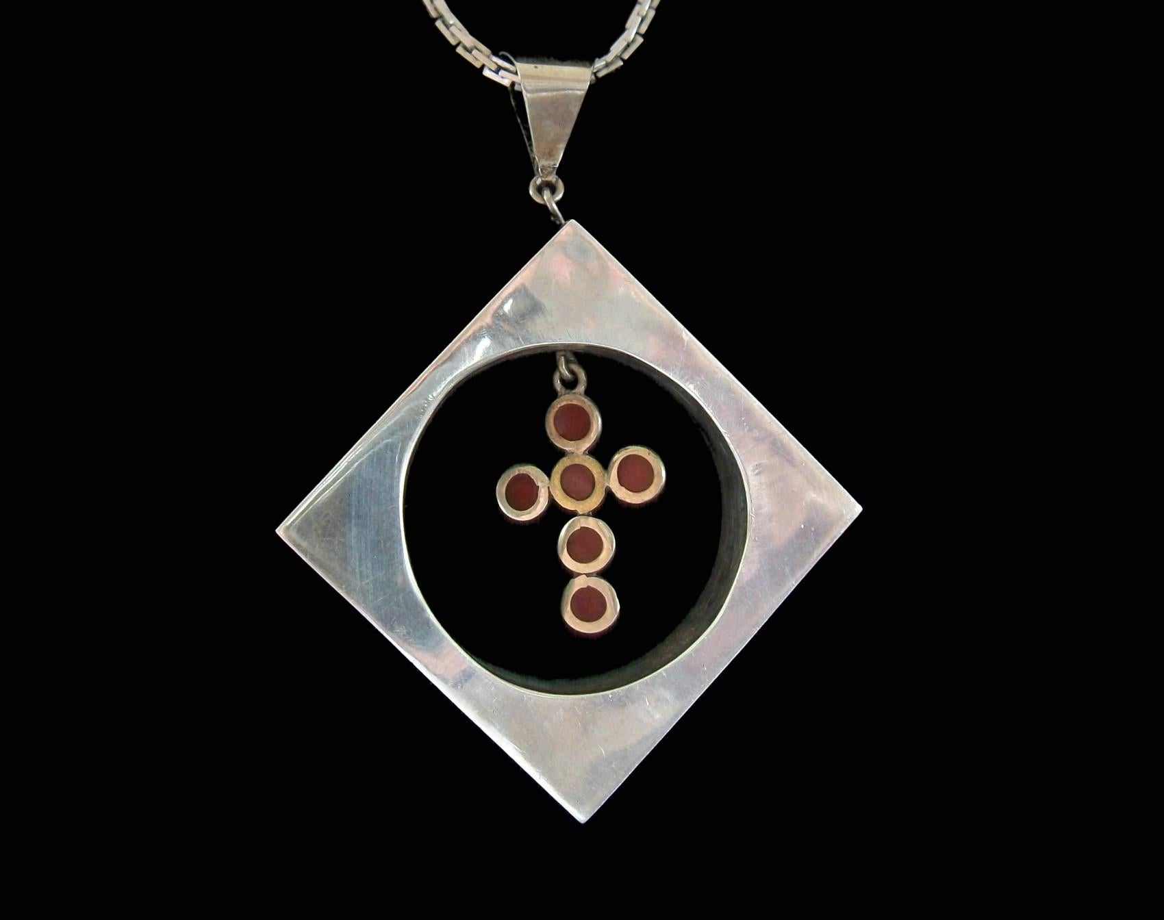 Modernist sterling silver and mixed metals (copper and brass) enameled pendant with plique-à-jour enamel cross - each outside panel with a unique design - hollow construction - large bale (1/2