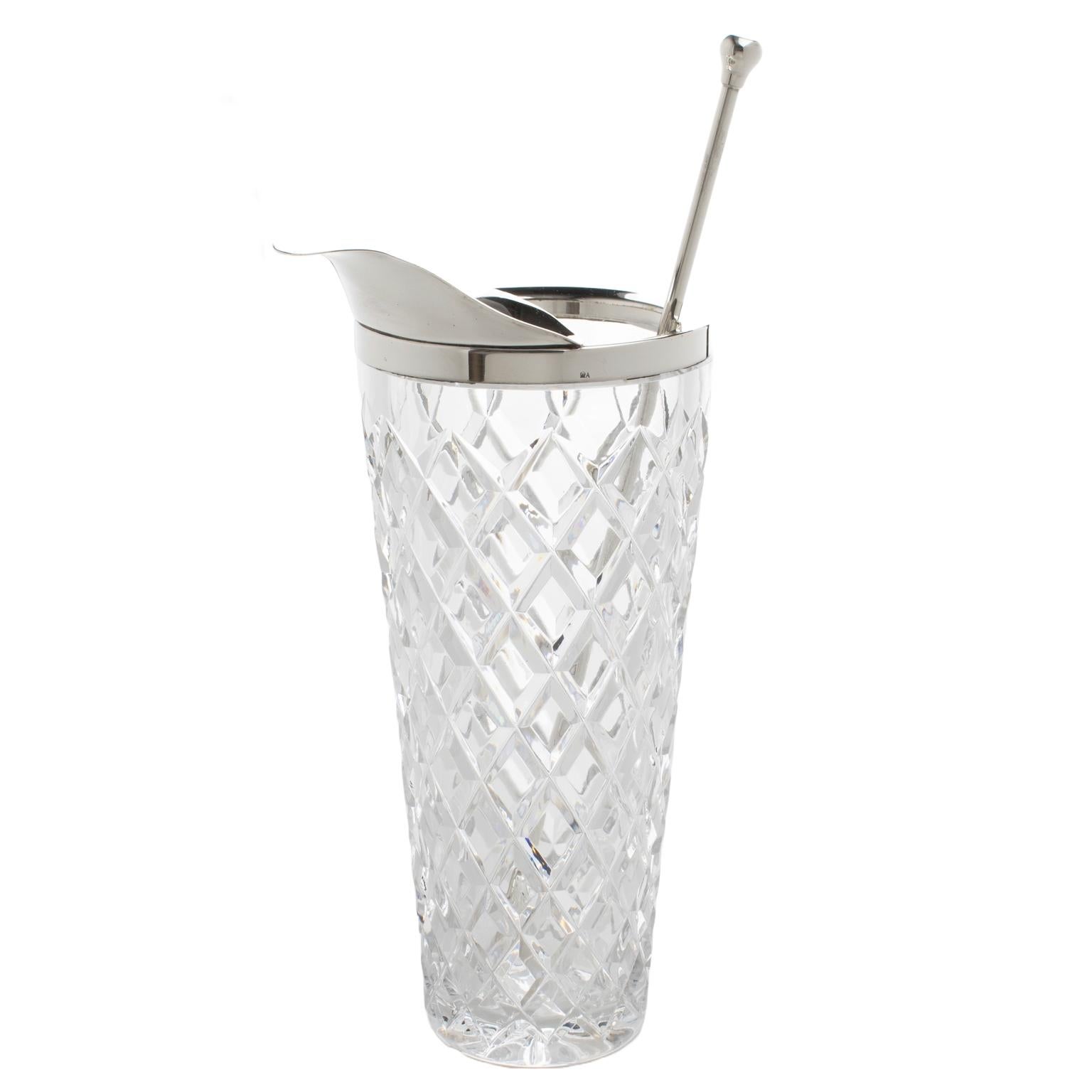 A lovely Art Deco barware set designed in France in the 1940s. A tall etched crystal and silver plate Martini pitcher or mixer jug and a long stirrer spoon complete the set's elegant appearance. The crystal carafe has a silverplated metal lip and