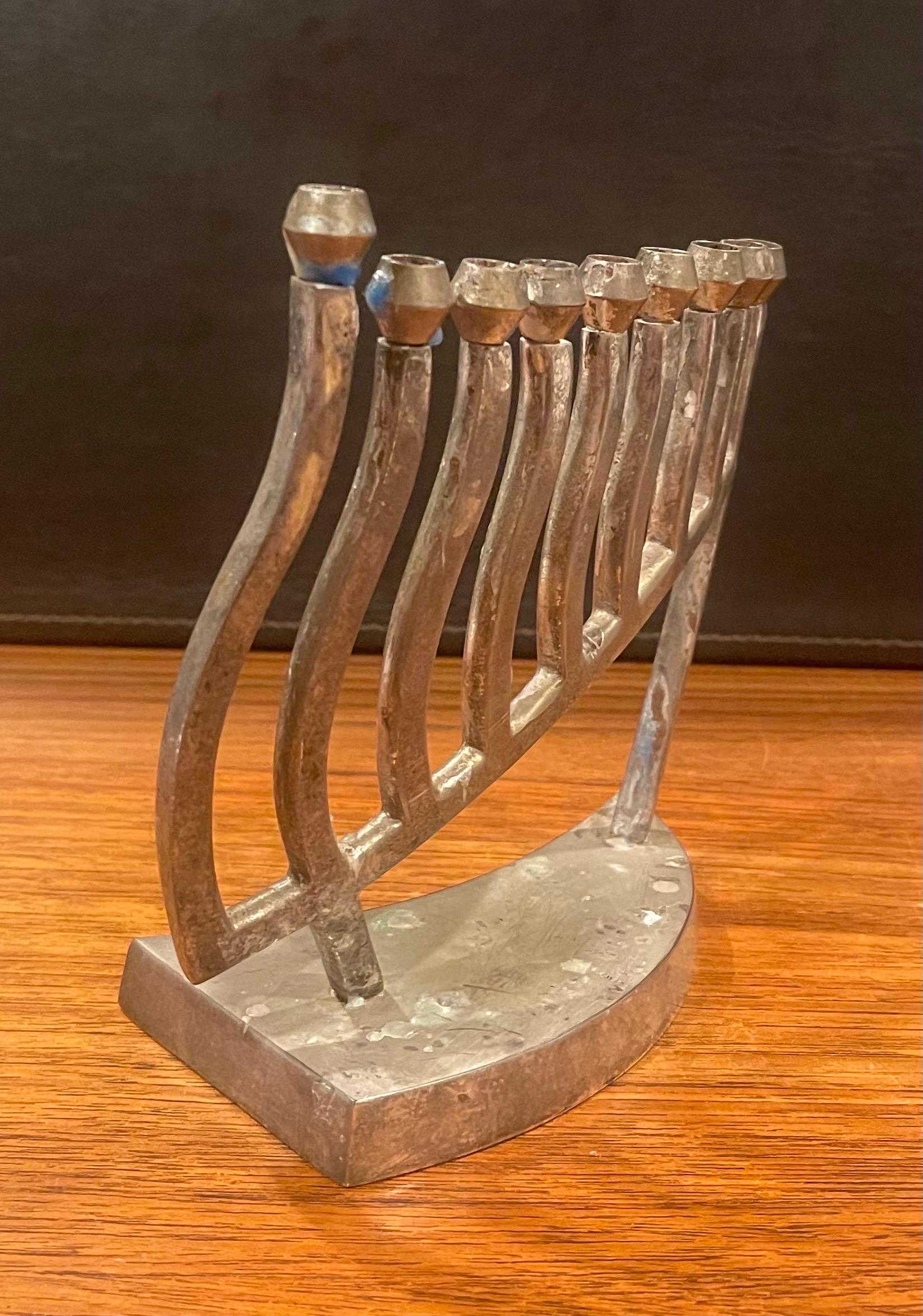 Modernist silver plate menorah, circa 1970s. The menorah is in fair condition with some spotting to the plate and measures 6.5