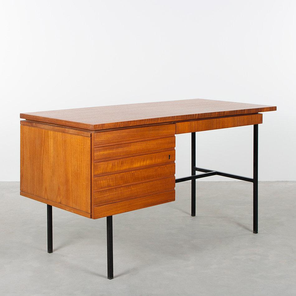 Elegant modernist small desk by an unknown designer. Teak veneer and black coated steel frame all in good vintage condition with minor traces of use.