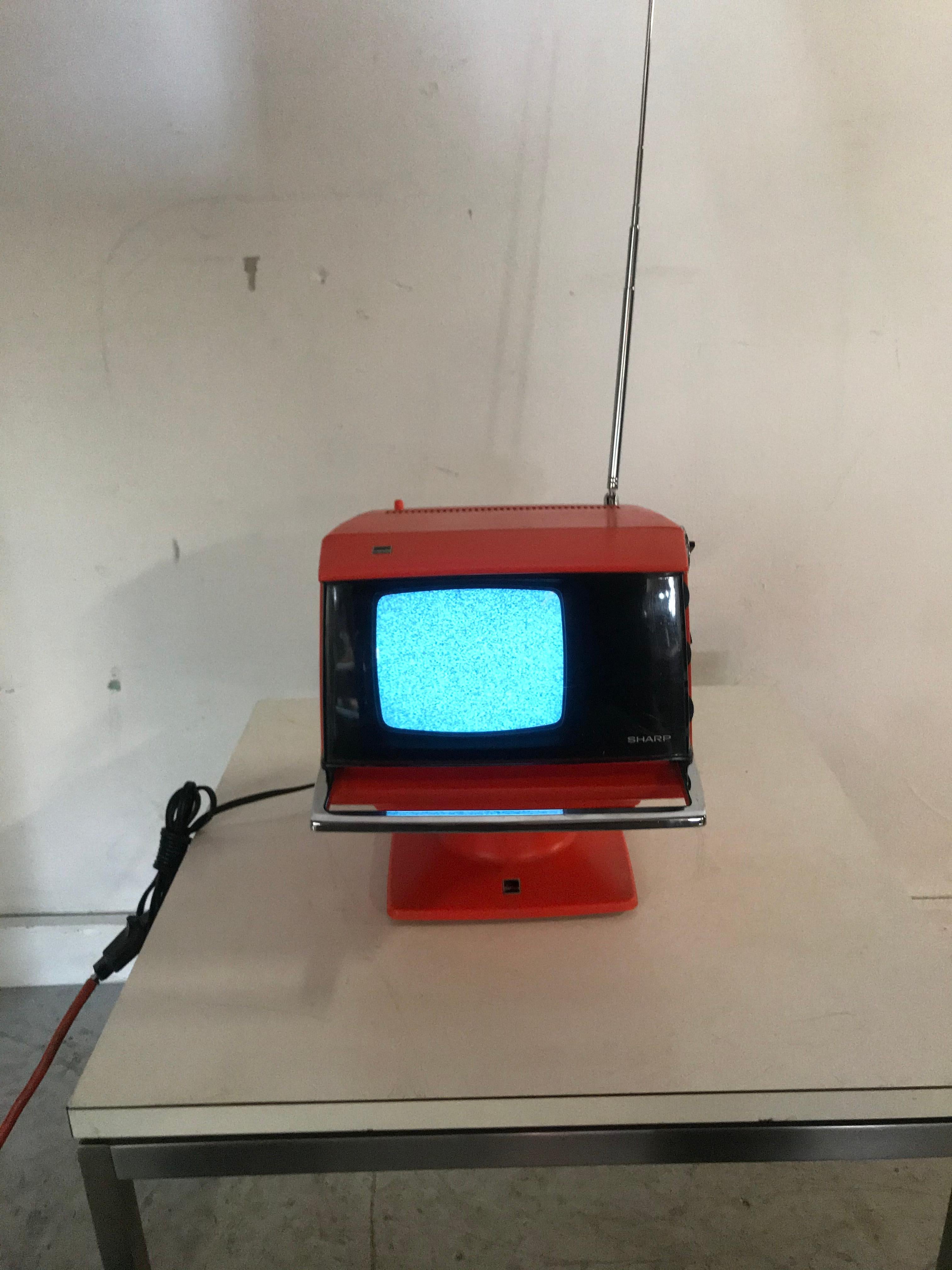 Modernist Space Age sharp television, model 3S-111 R..JAPAN, circa 1970. Amazing design, tested and in wonderful working condition

Note: The TV detaches from the base (which holds the transformer/power) and the chrome bar presses in to release to