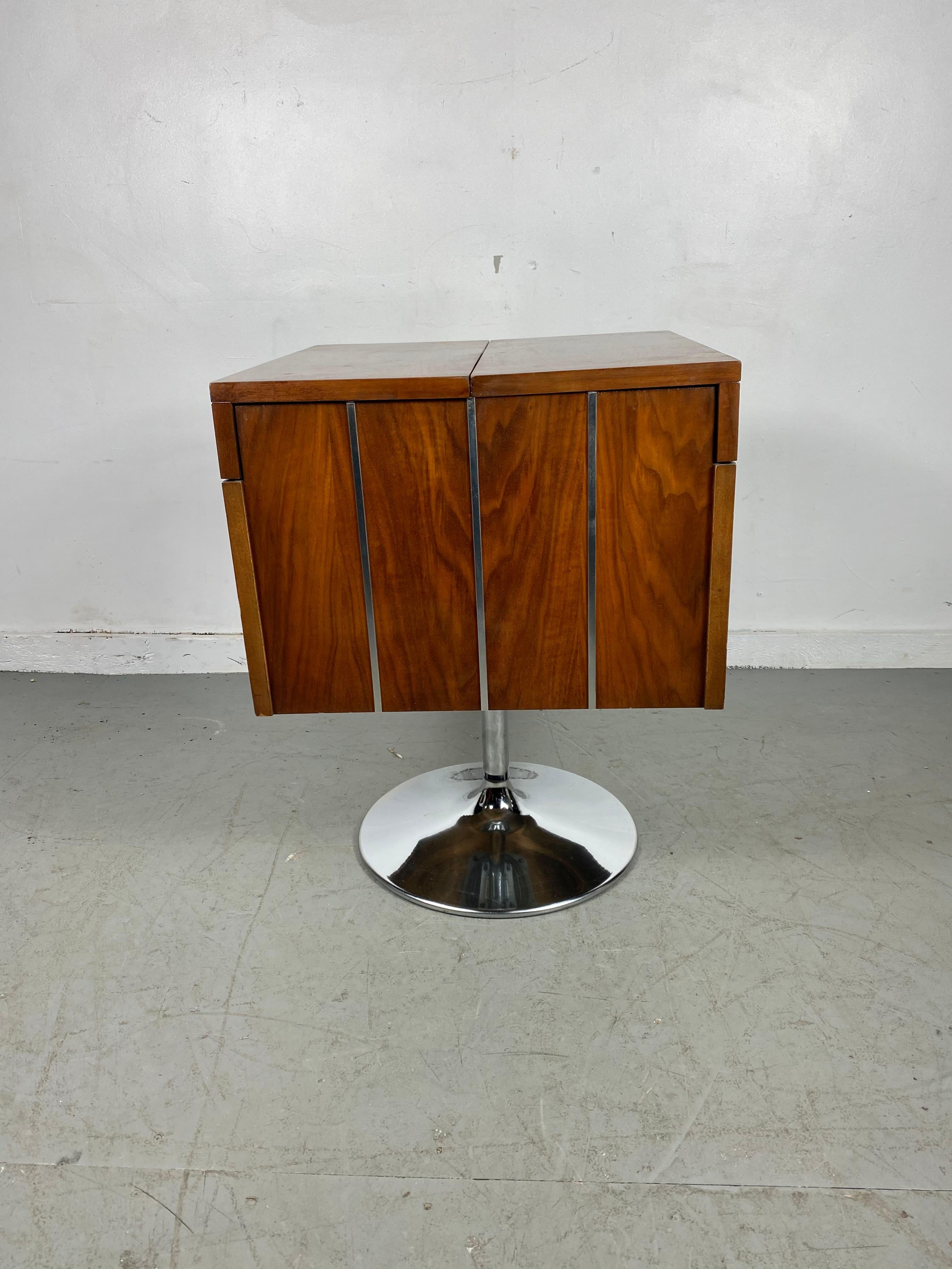 Modernist, Space Age walnut and chrome folding, revolving bar by LANE. Great design, book matched wood graining, chrome tulip pedistal, full 360 degree rotation, retains original insert for ice bucket, glasses etc. Bar measures 21 x 21 x 27