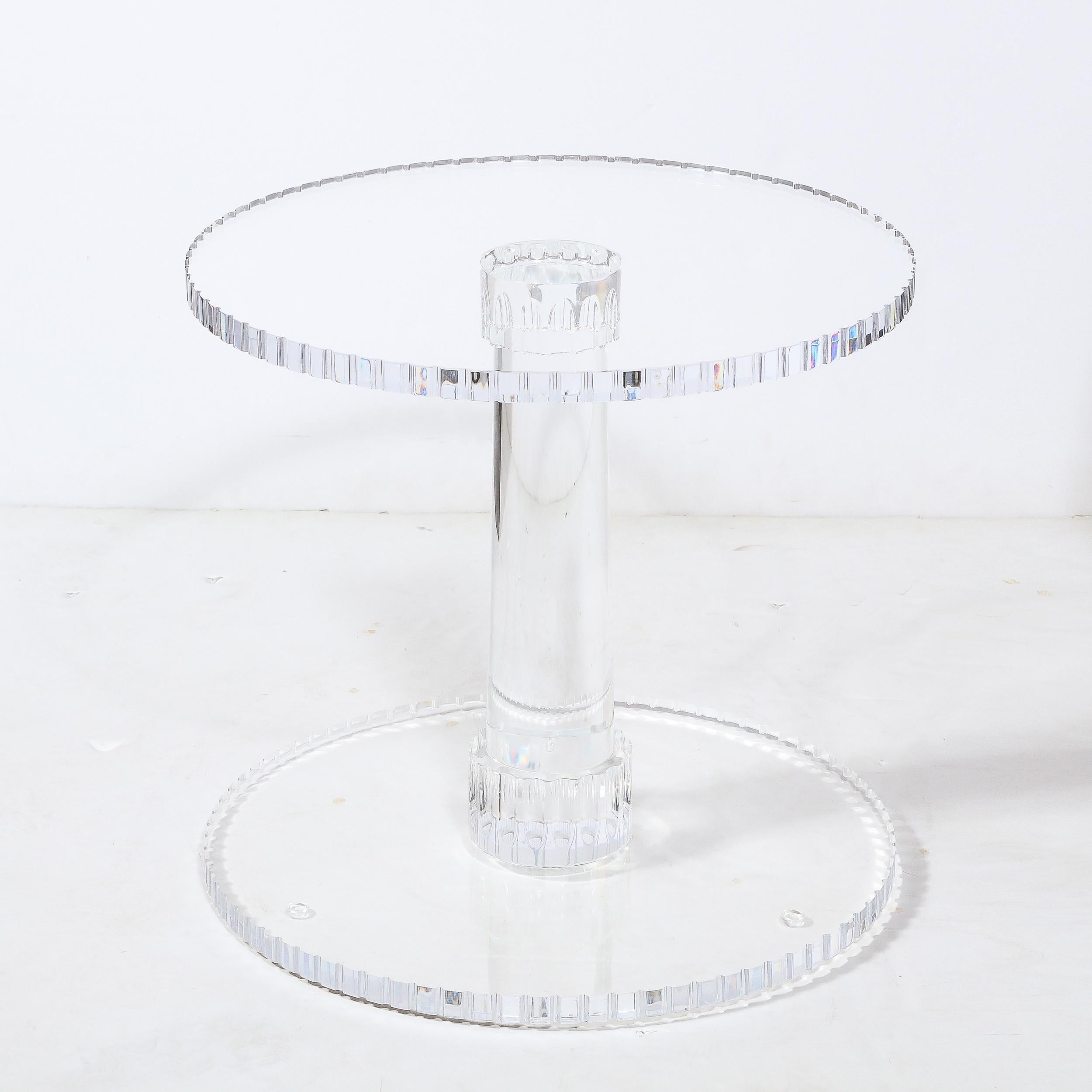 This sophisticated spool form occasional table was realized in the United States during the latter half of the 20th century. It features a circular base and bottom with a crenelated perimeter replete with an abundance of miniature serrations imbuing