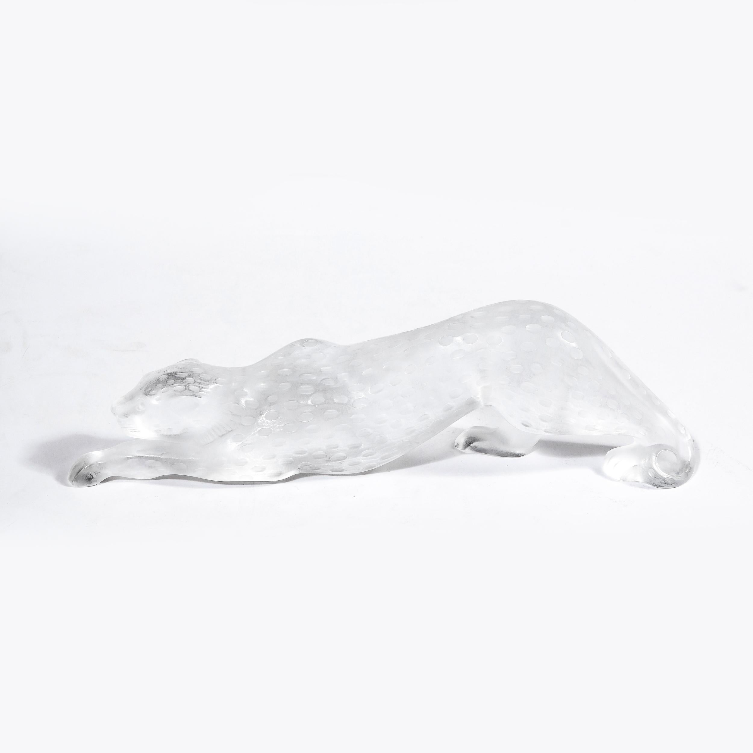 This elegant modernist frosted crystal leopard was realized in France by the legendary maker Lalique, circa 1980. It depicts a hunting panther, crawling low to the ground on all fours, apparently in the midst of stalking its prey. Realized in