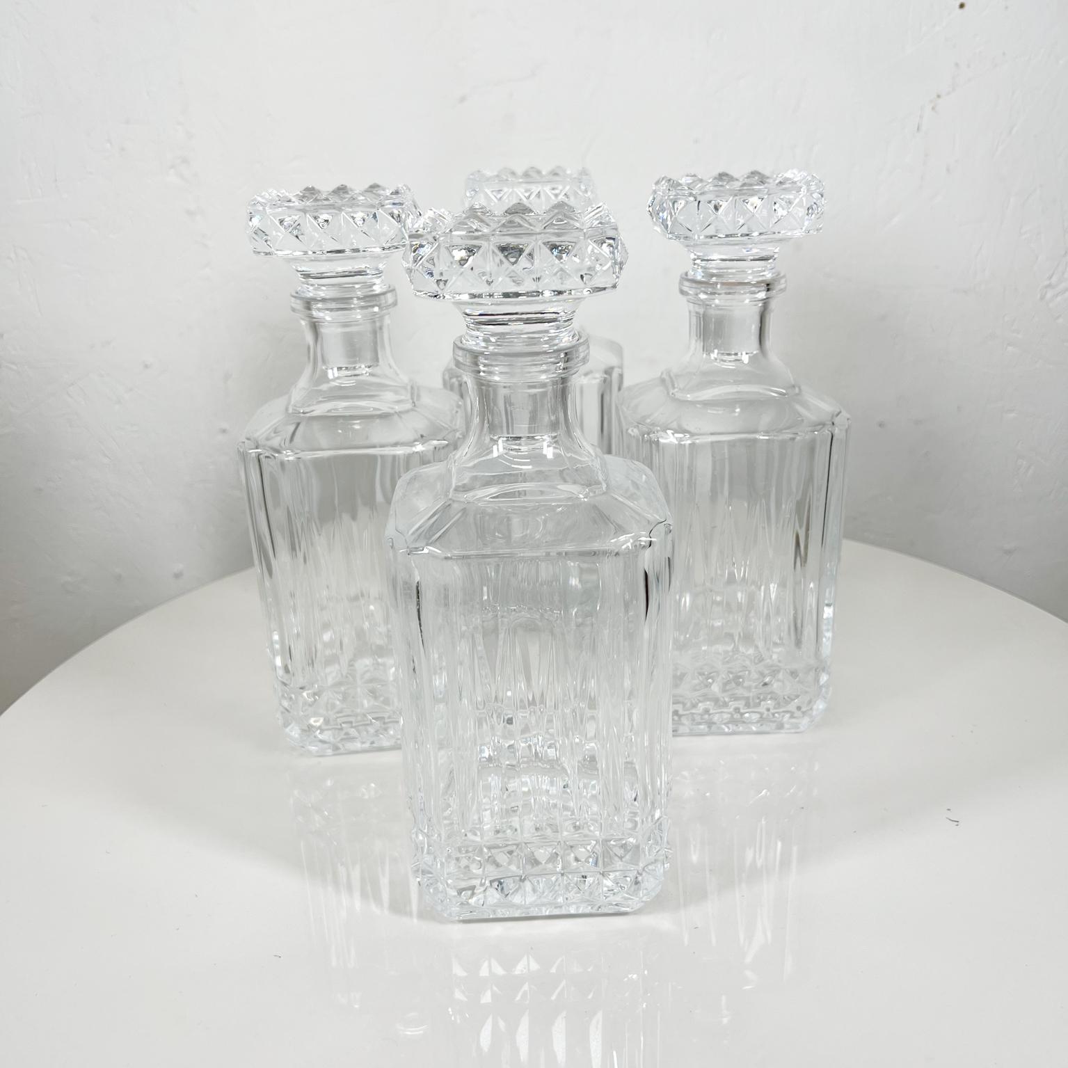 Modernist square cut glass decanters liquor bar whiskey bottle set of four
10 tall x 3.5 x 3.6
Four Bottles with matching bottle caps.
Beautiful design in square shape.
No information on maker
Original vintage condition.
See images