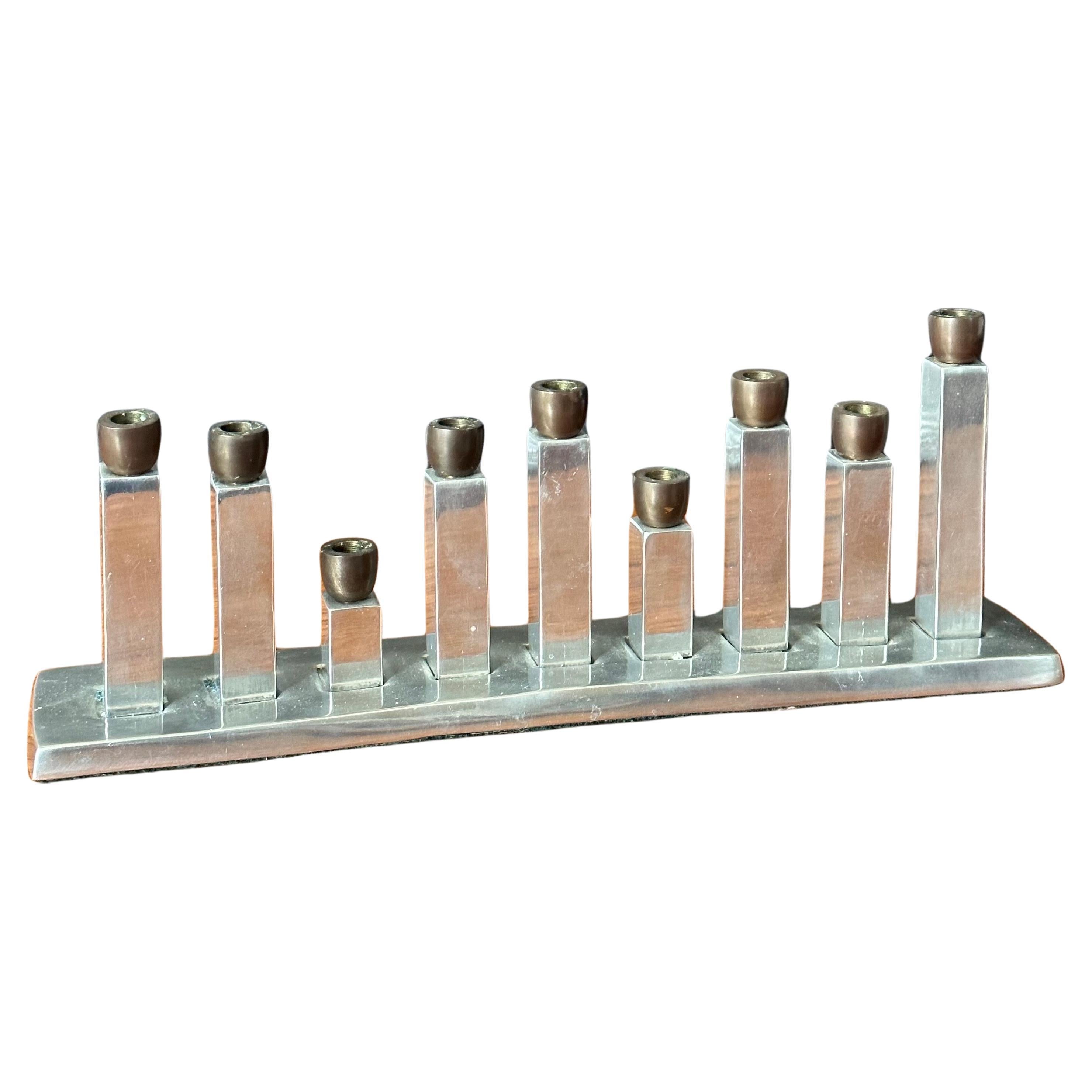Modernist stainless steel and bronze menorah, circa 1970s. The menorah is in very good vintage condition and measures 11.75